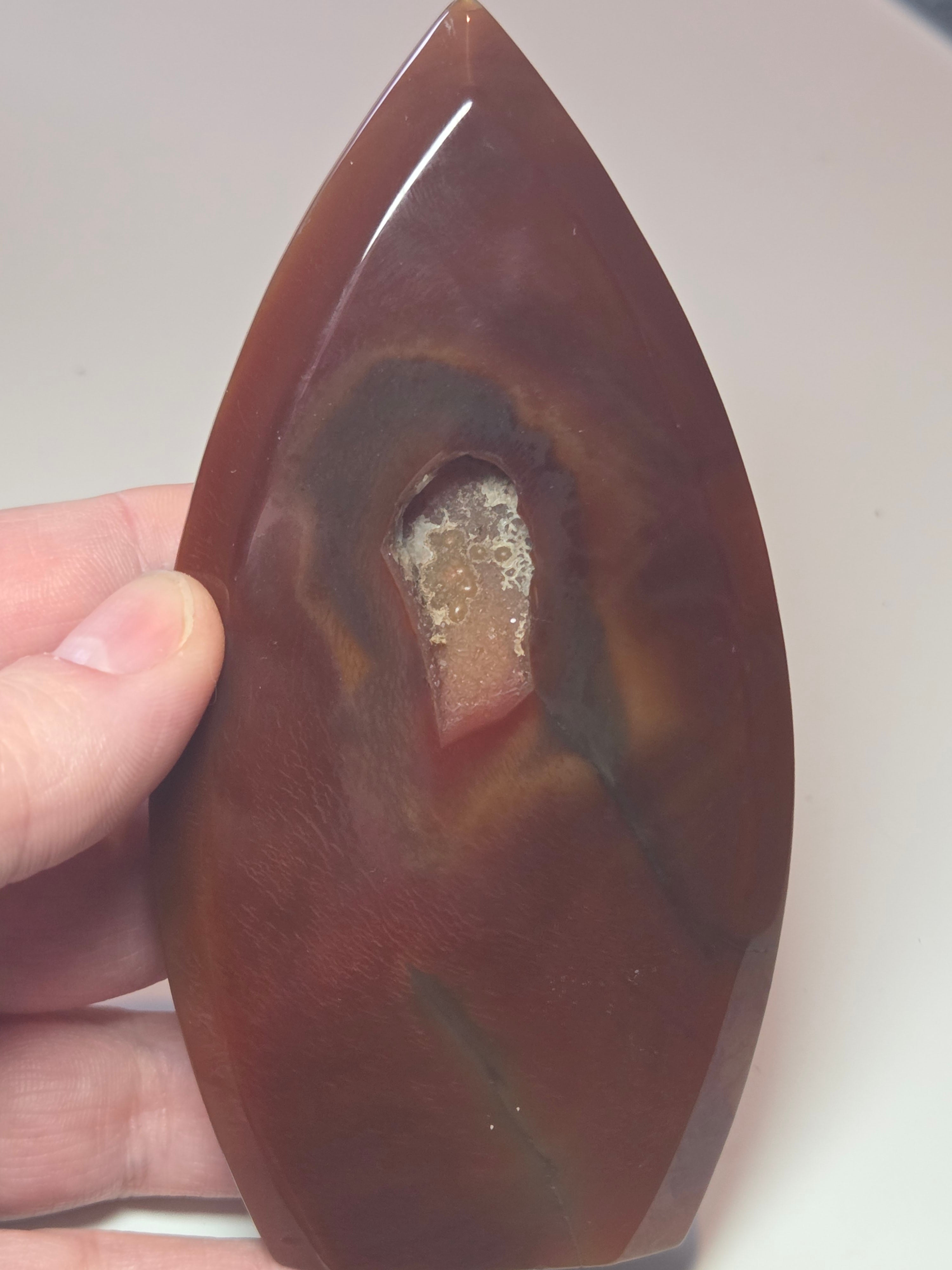 Carnelian crystal drop with imperfections