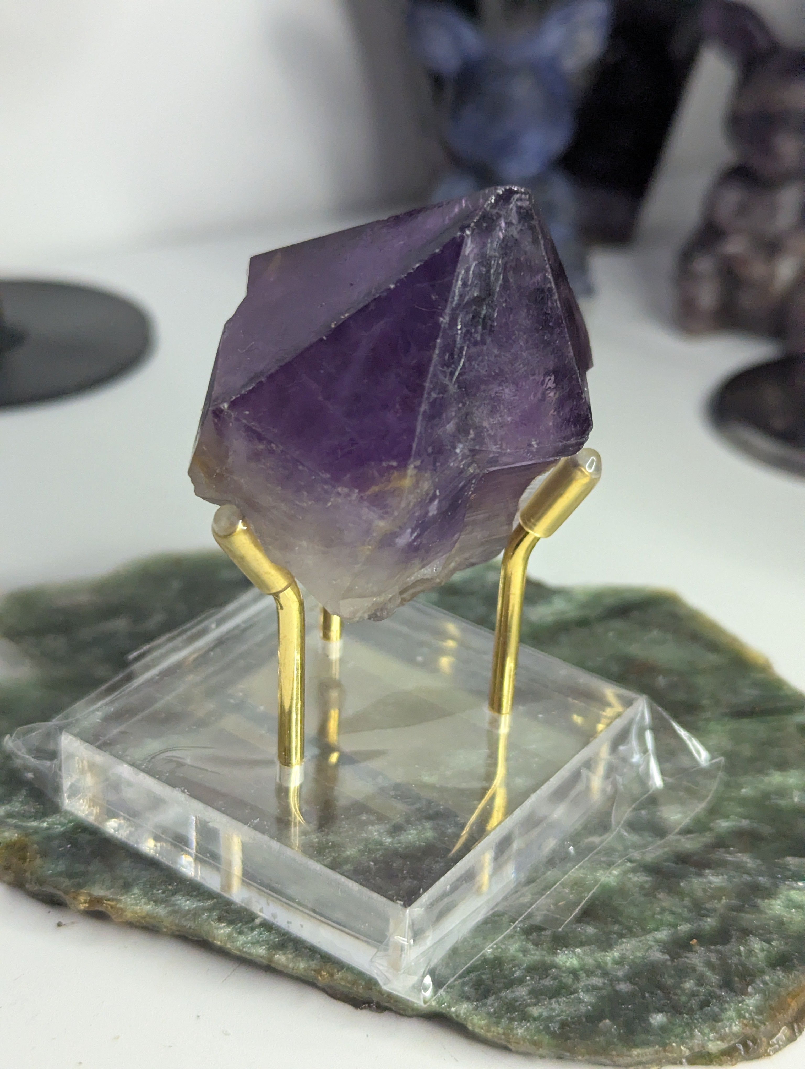Amethyst crystal tooth from Brazil with stand