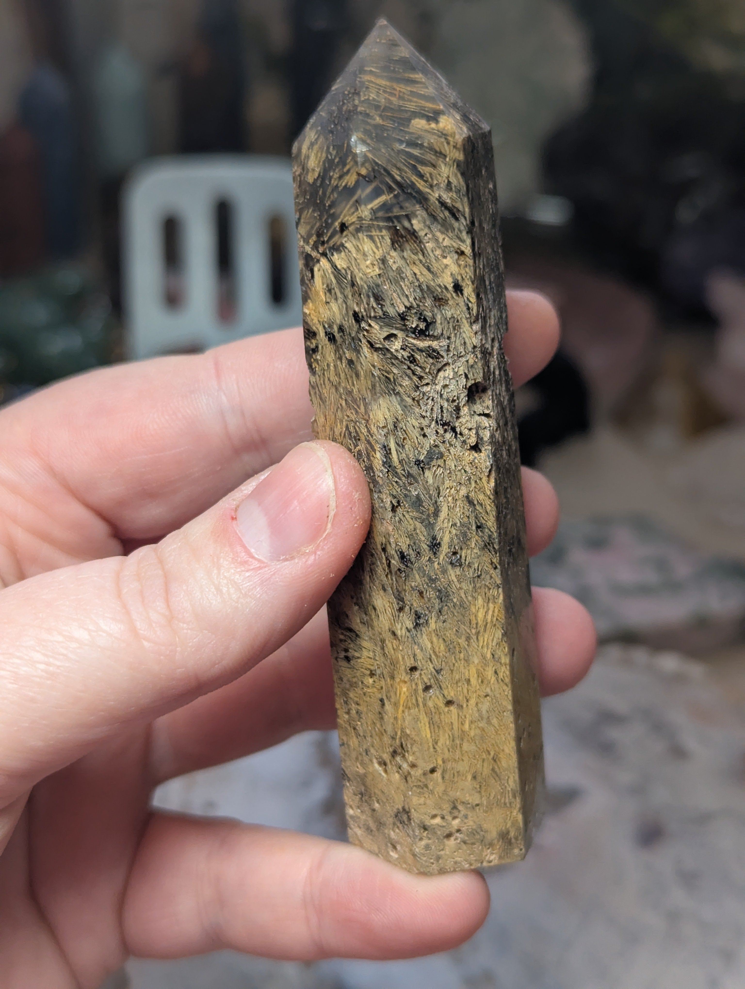 Golden rutile in black agate tower