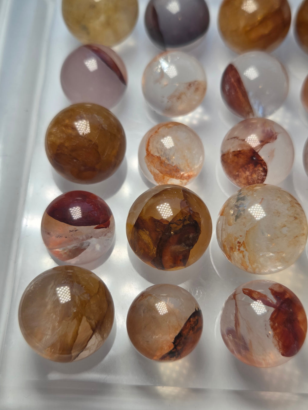 Mini crystal sphere fire quartz and golden healer- with stand