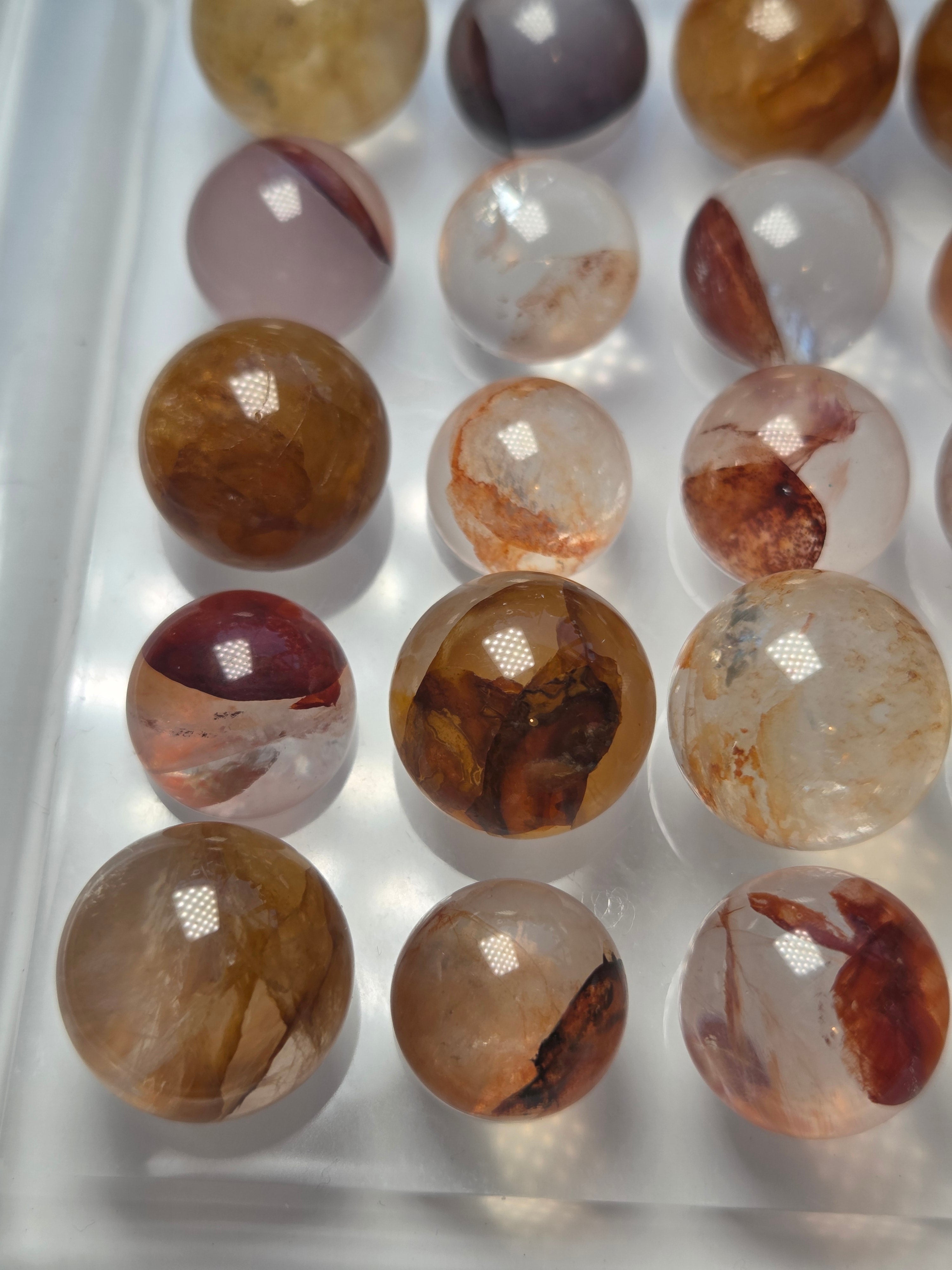 Mini crystal sphere fire quartz and golden healer- with stand