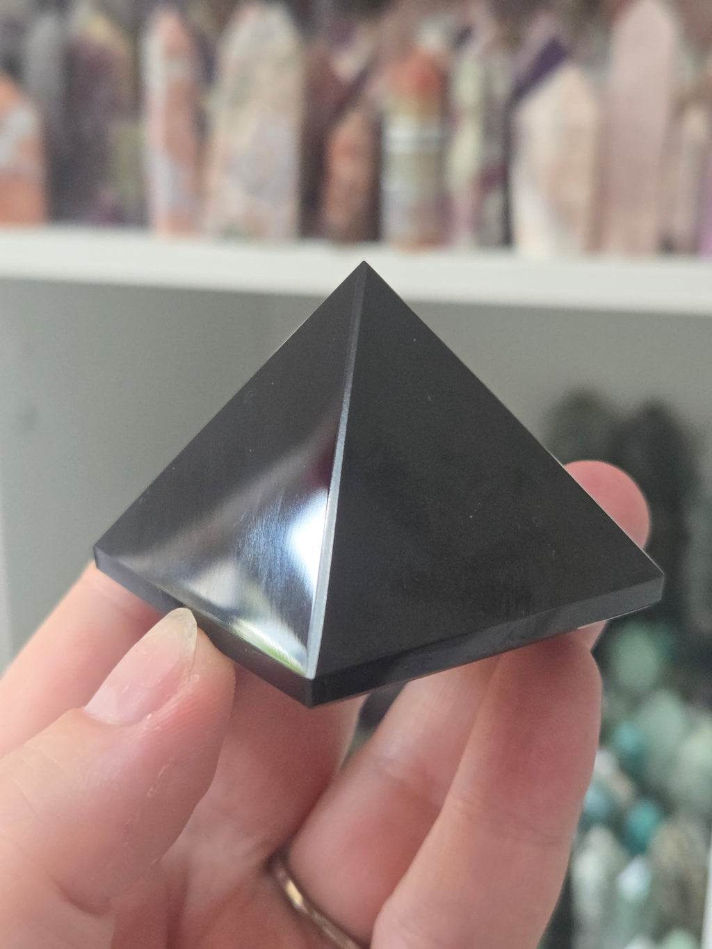 Black obsidian crystal pyramid carving