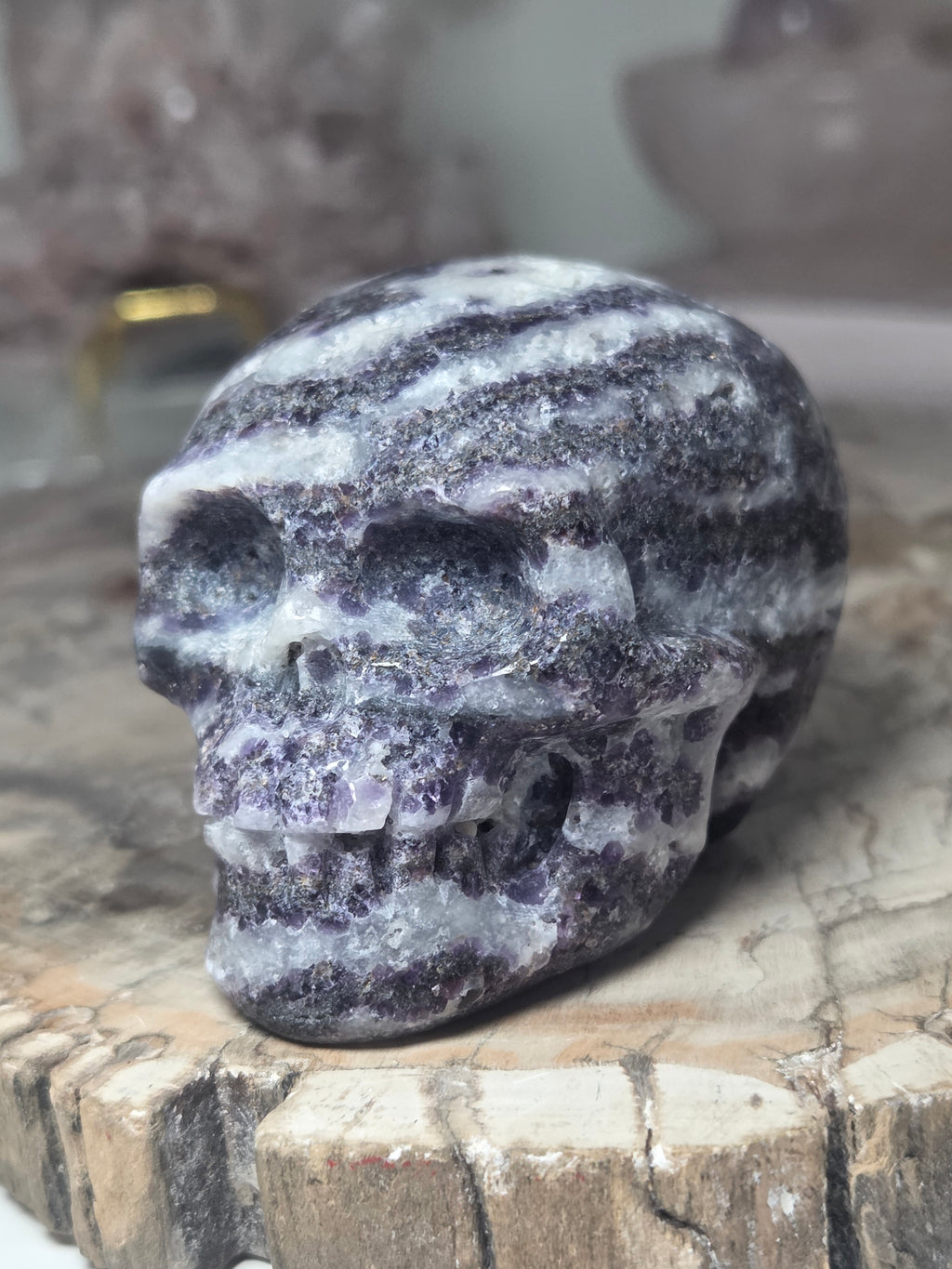Purple zebra jasper crystal skull carving