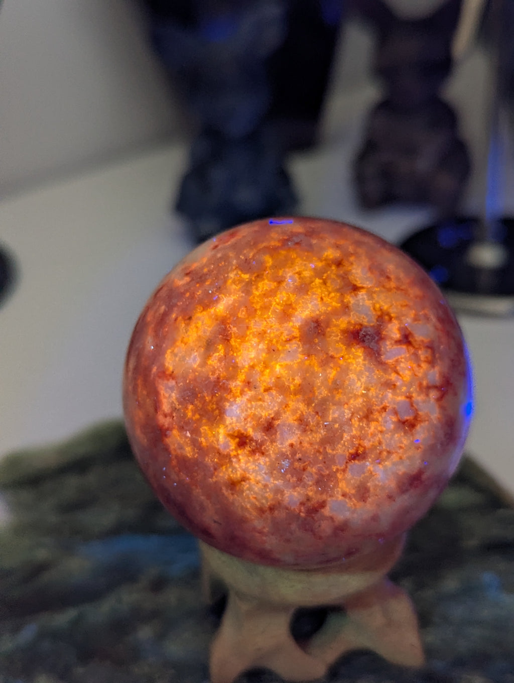 Pink Zoiltie crystal sphere with Orange UV