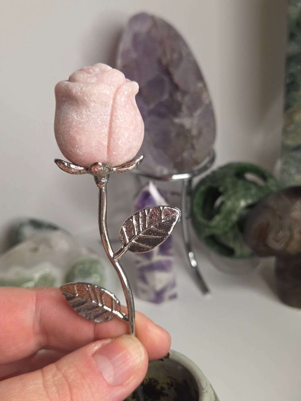 Pink opal crystal rose on stand