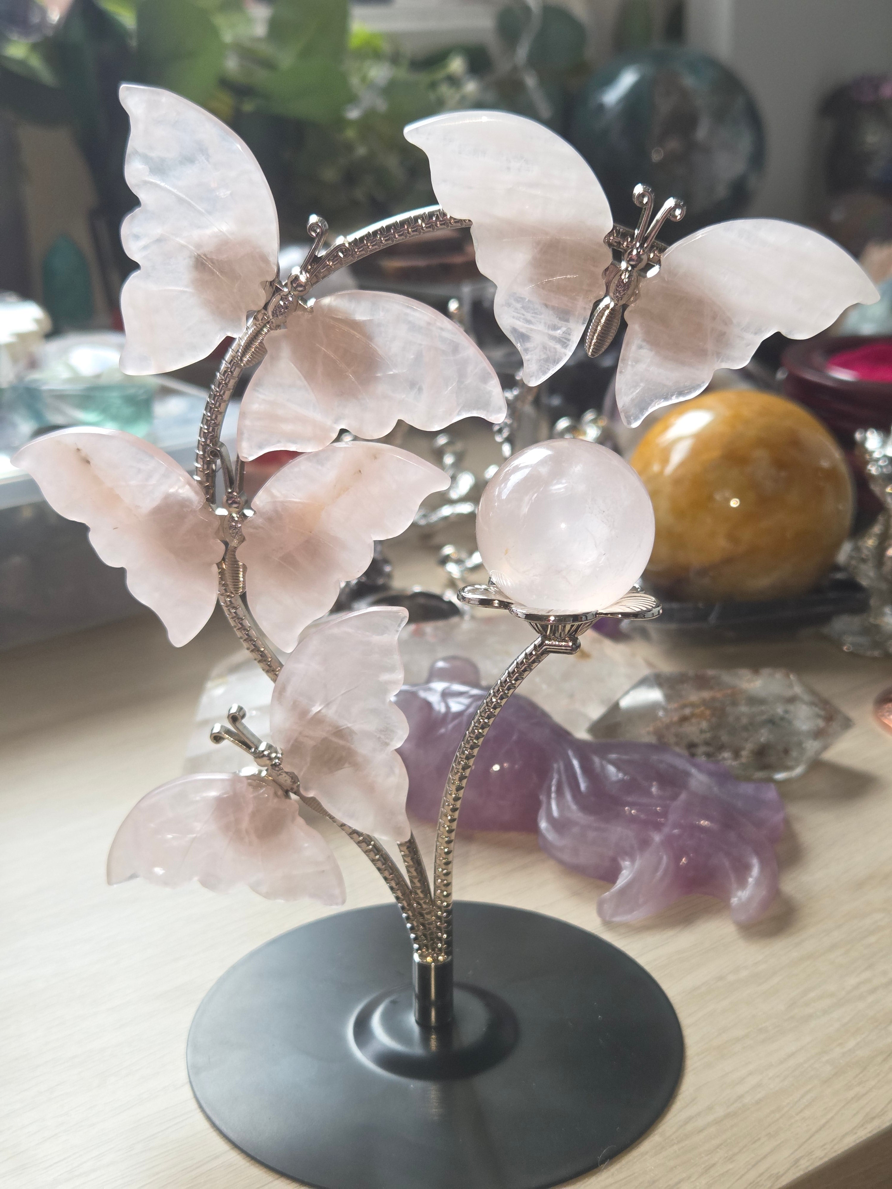Rose quartz crystal sphere and  butterfly stand