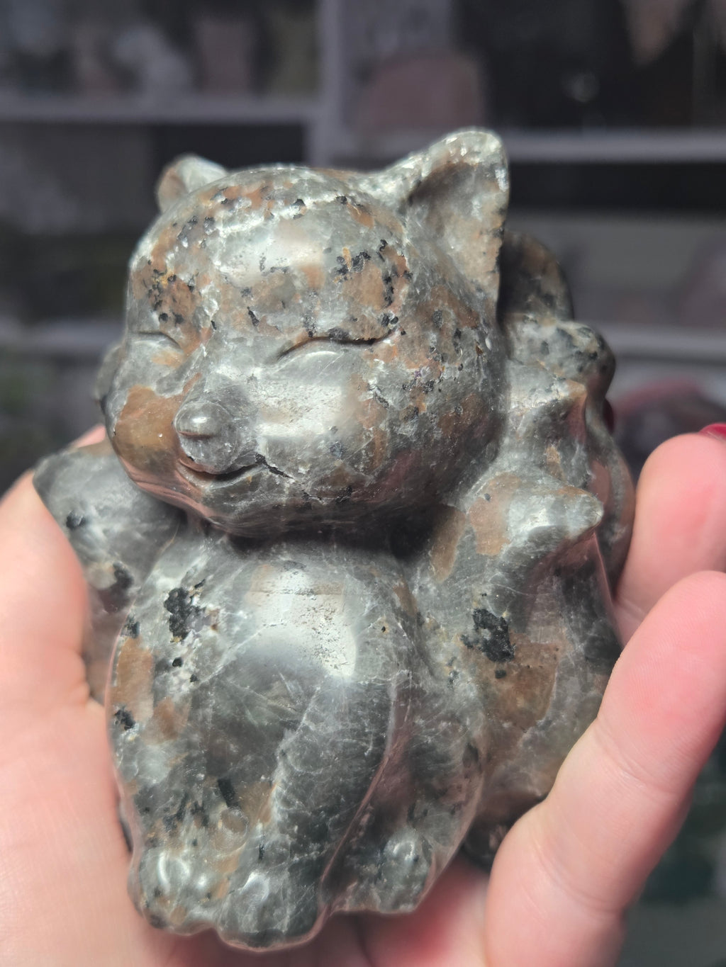 Large Yooperlite crystal 9 tail fox carving