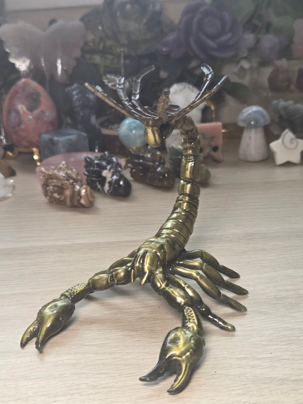 Golden scorpion sphere stand