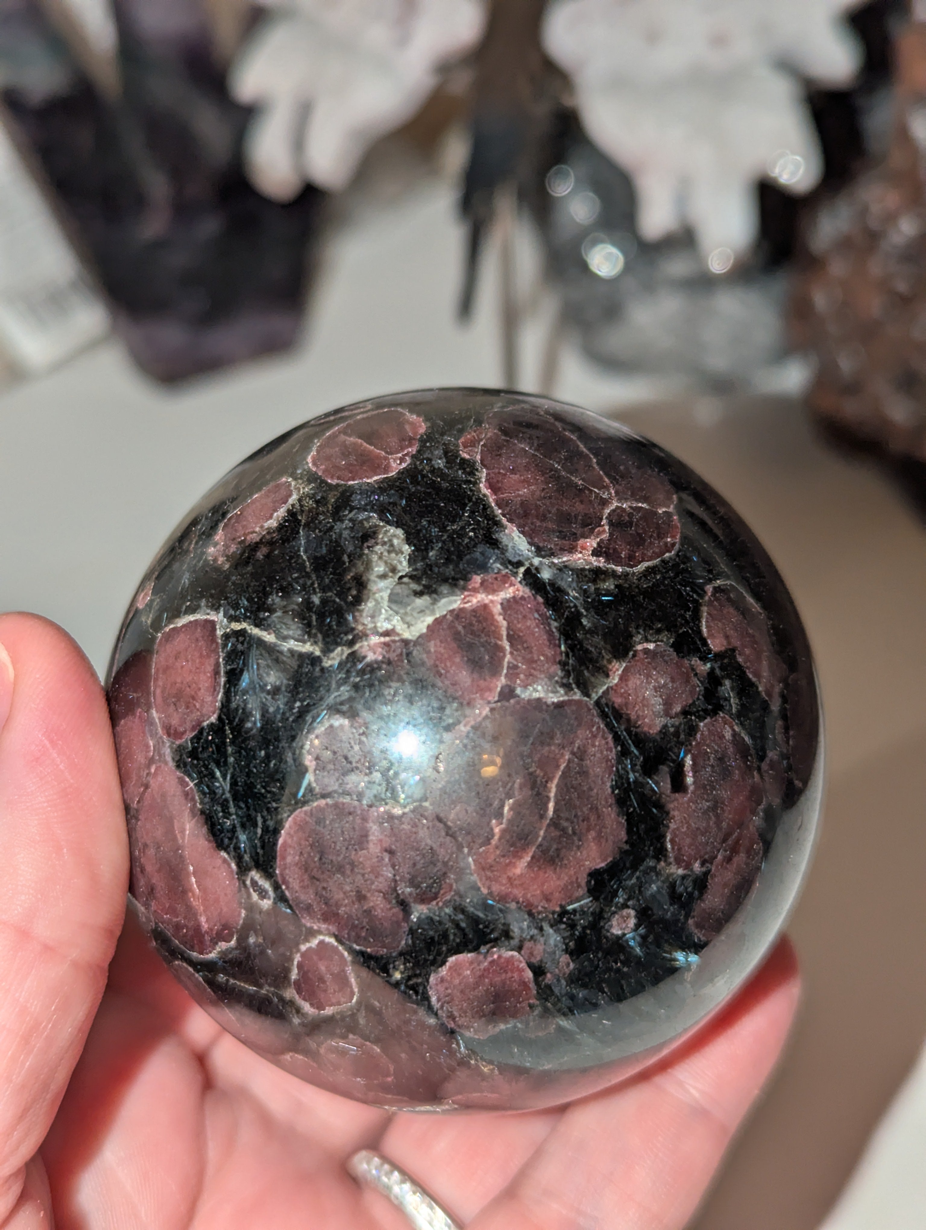 Astrophylite crystal sphere with garnet
