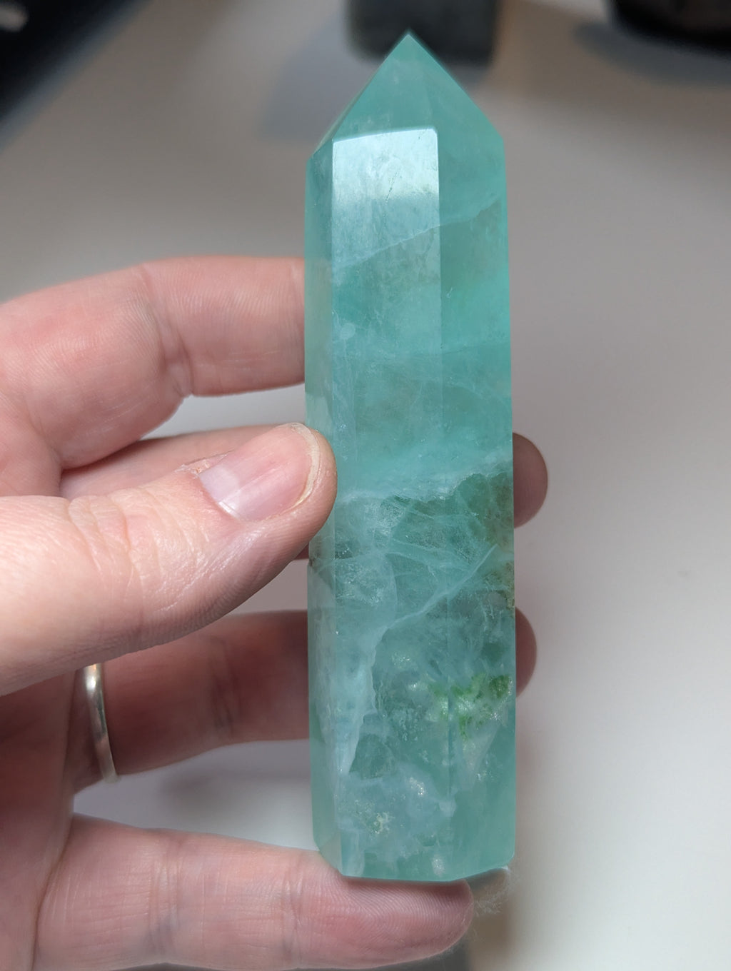 Green flouite crystal tower with imperfections