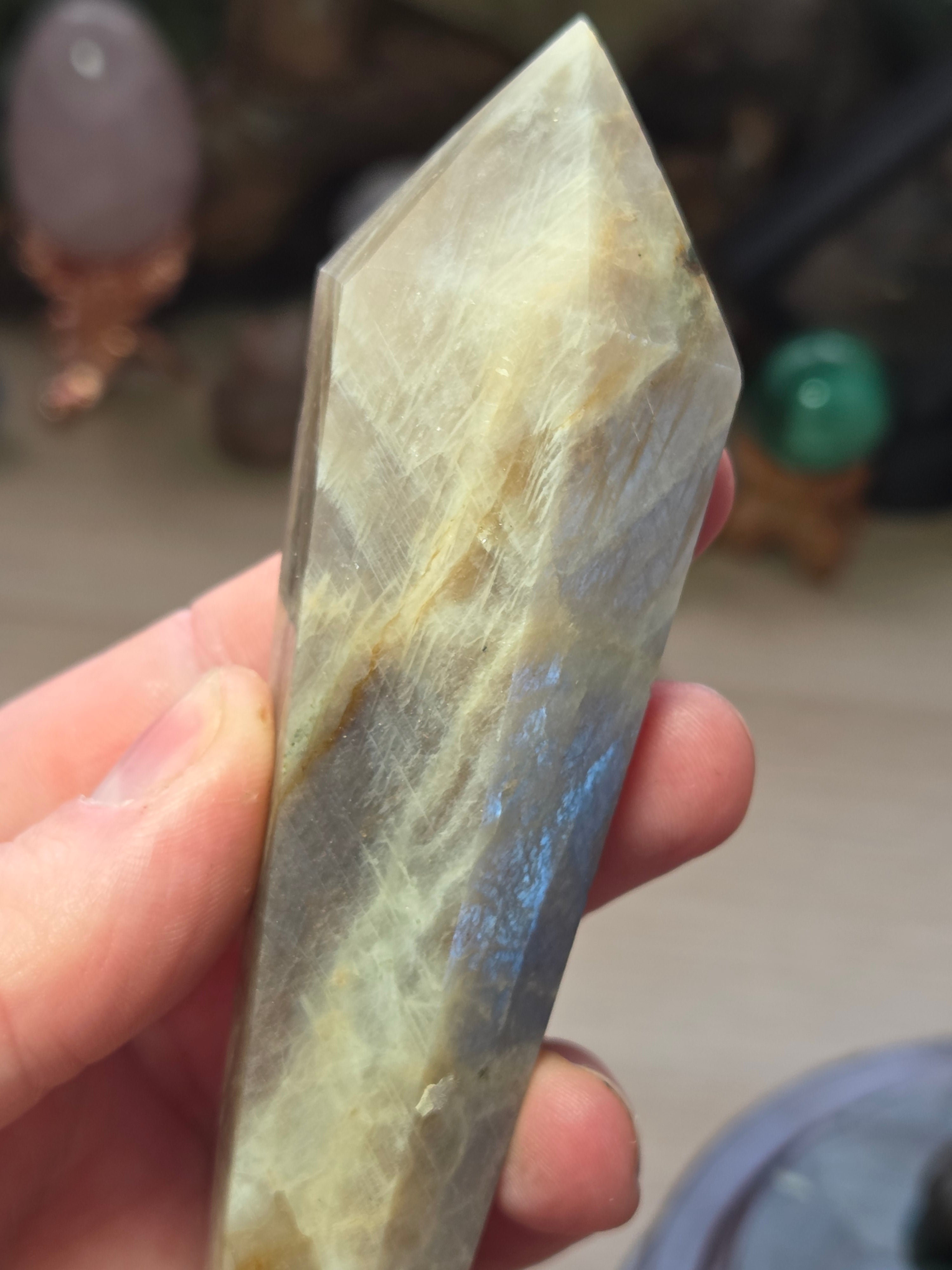 Rainbow moonstone and sunstone crystal wand carving with stand