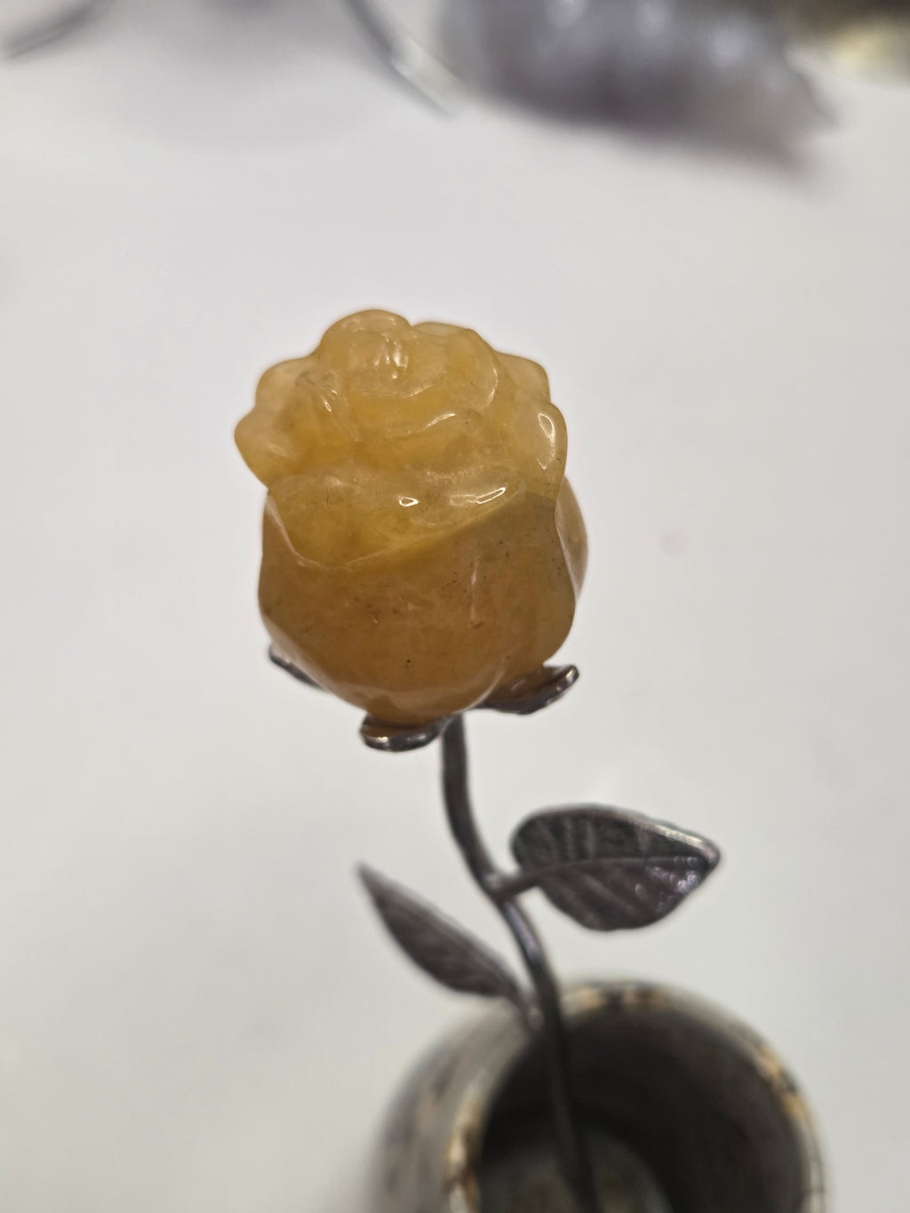 Golden healer crystal rose carving on a stem