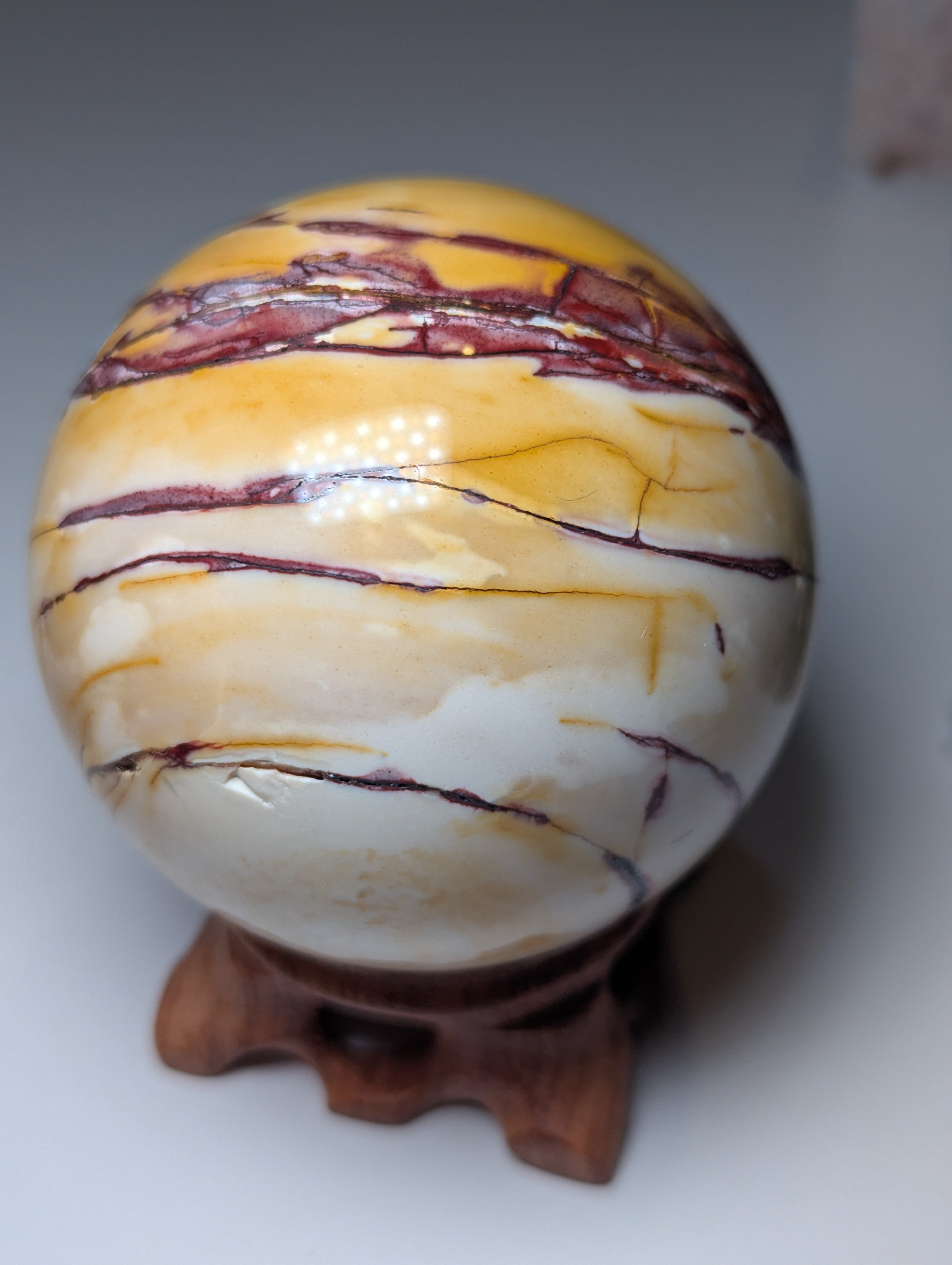 Mookaite crystal sphere with stand