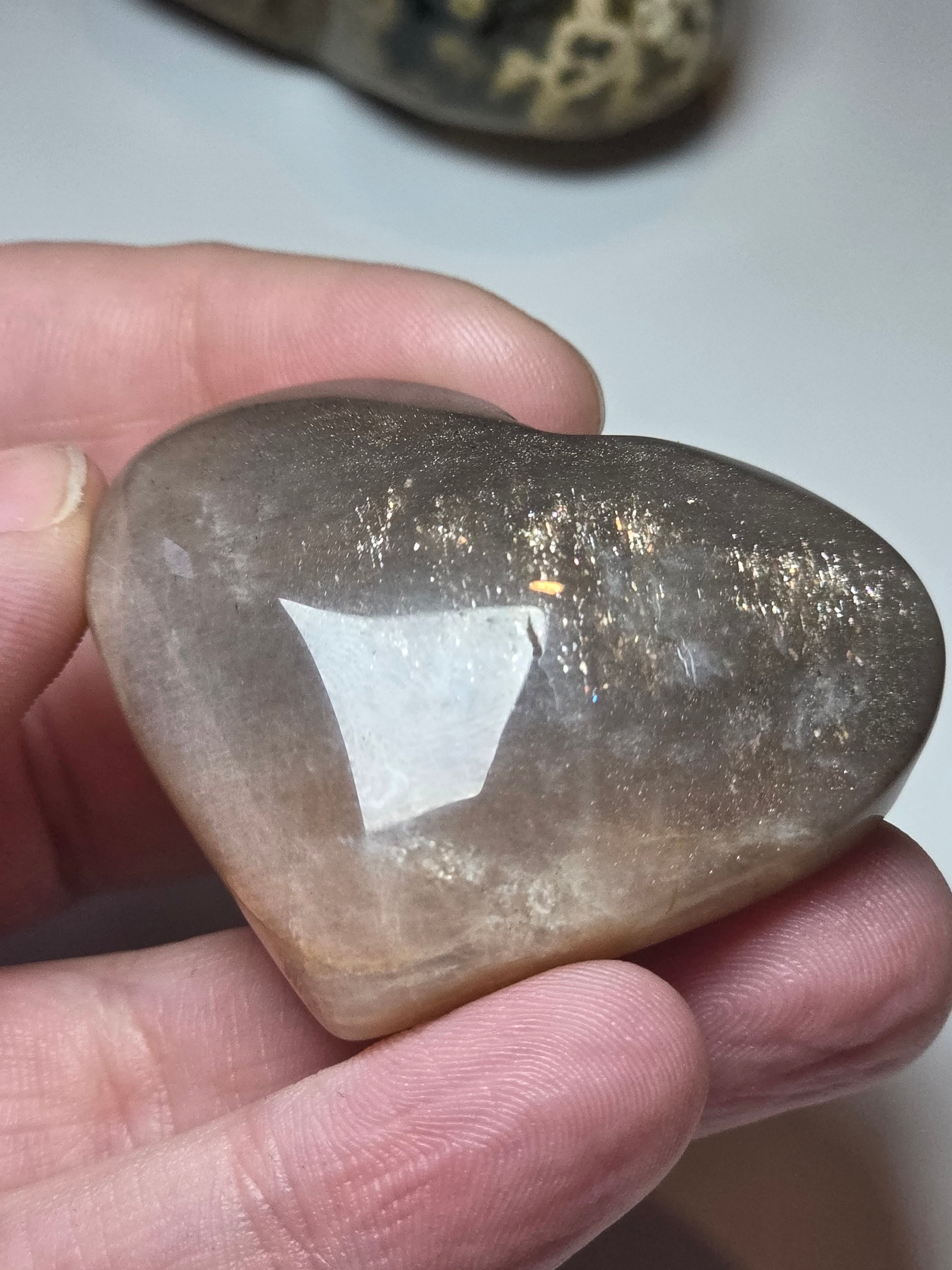 Sunstone and moonstone crystal heart carving with imperfections