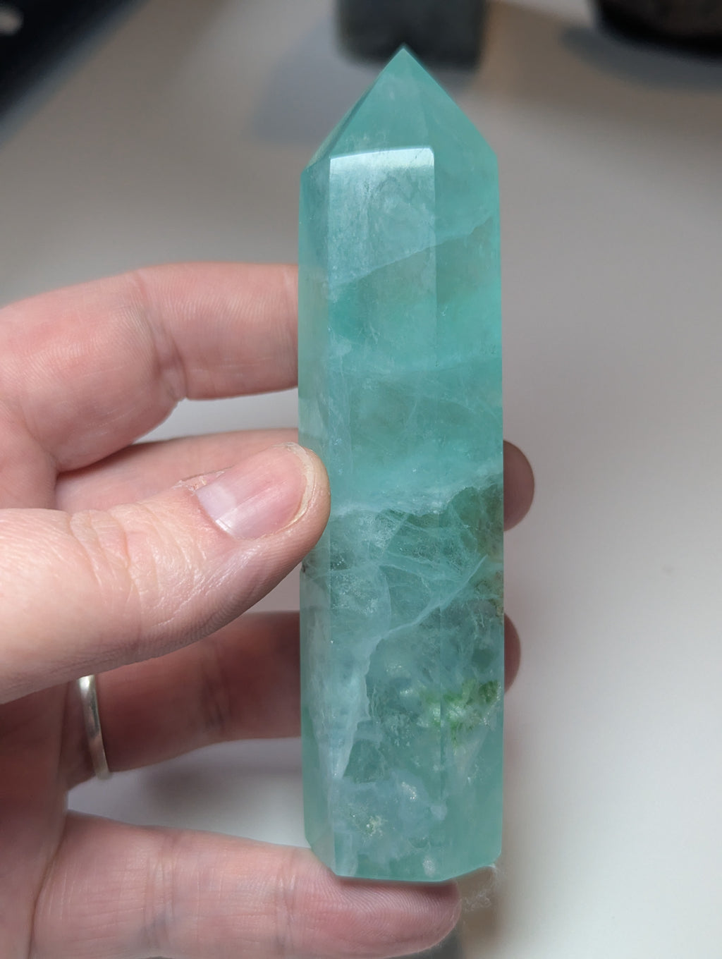 Green flouite crystal tower with imperfections