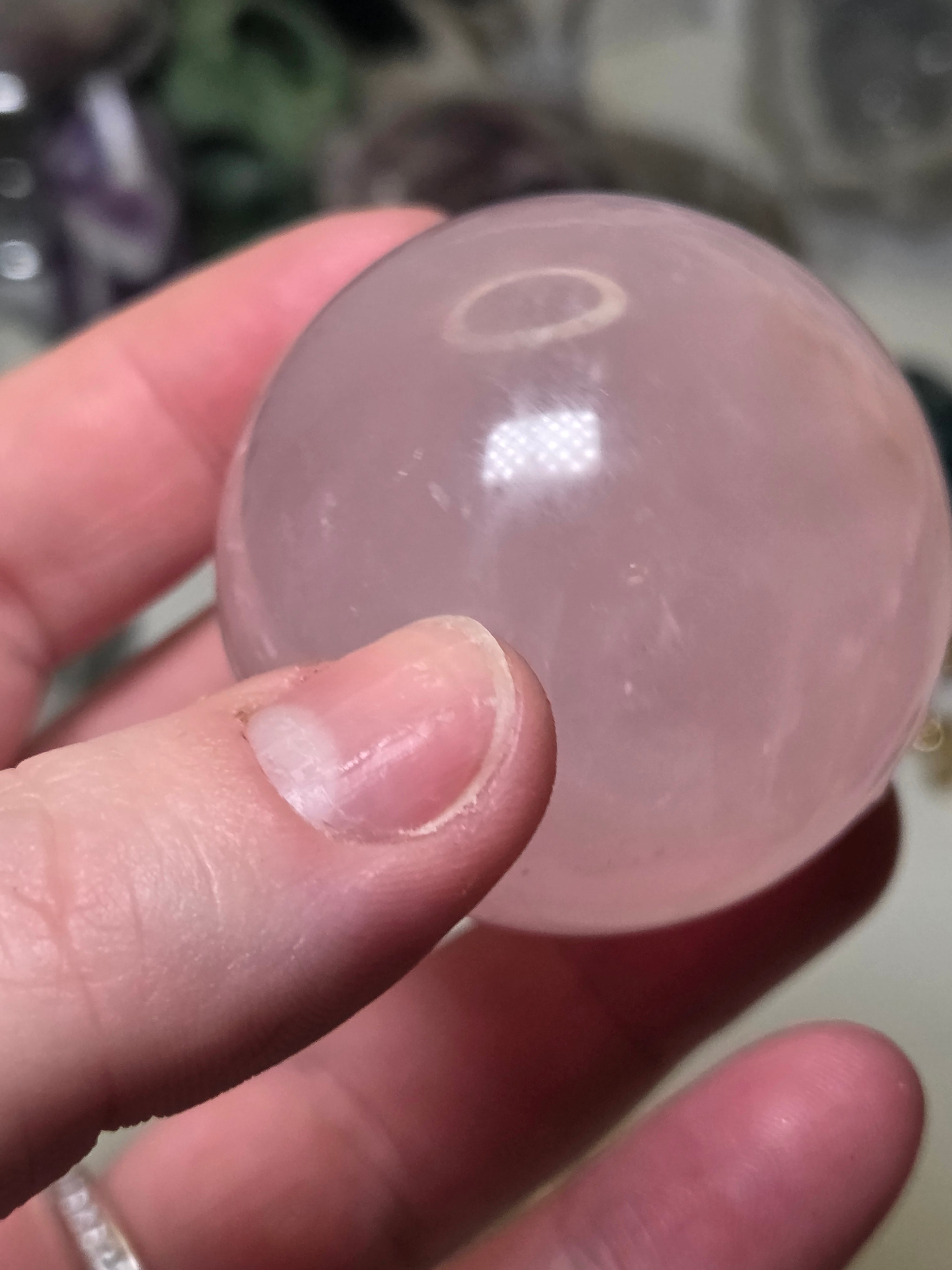 Rose quartz crystal sphere with  crack line and star flash