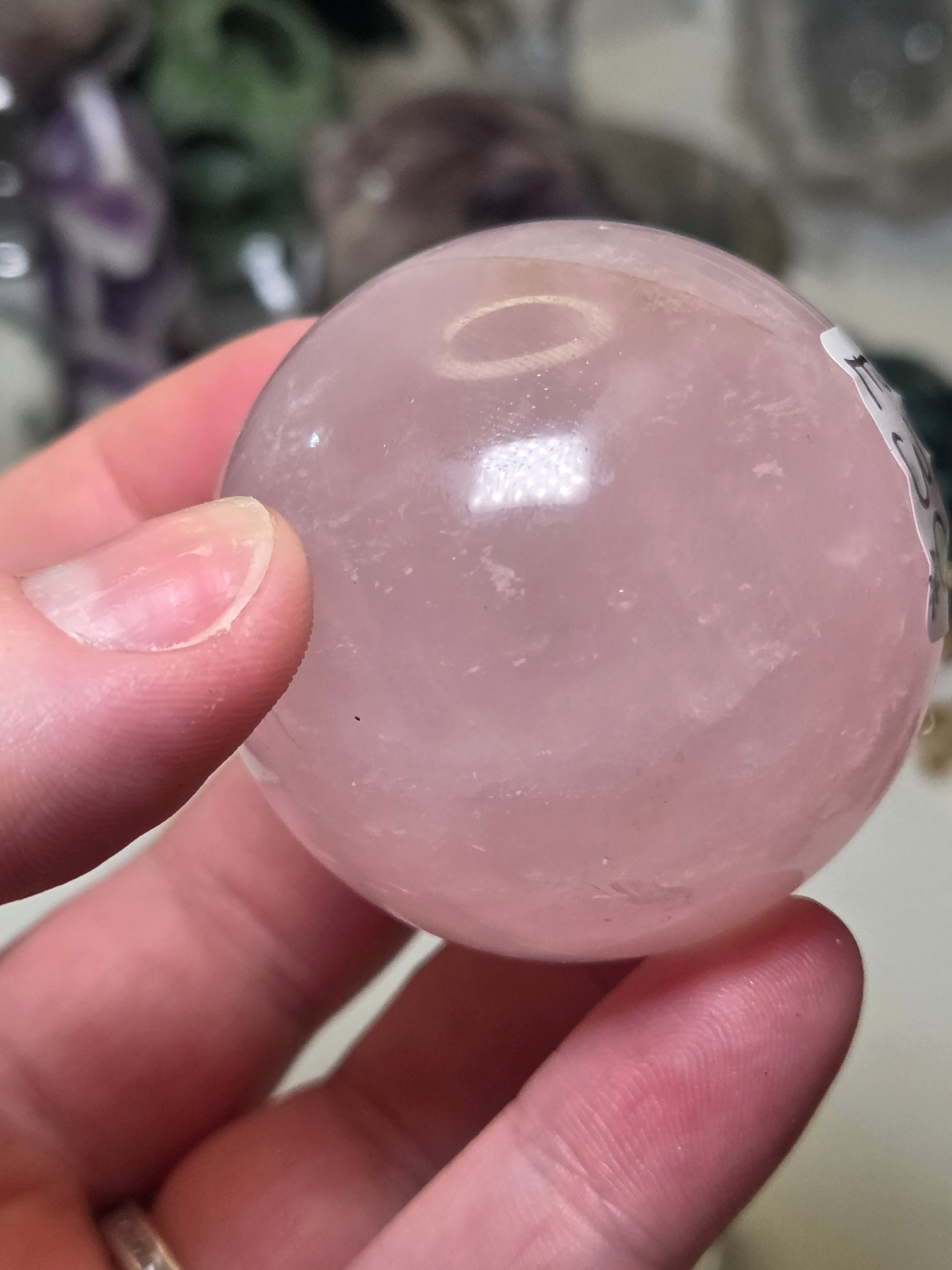 Rose quartz crystal sphere with  crack line and star flash