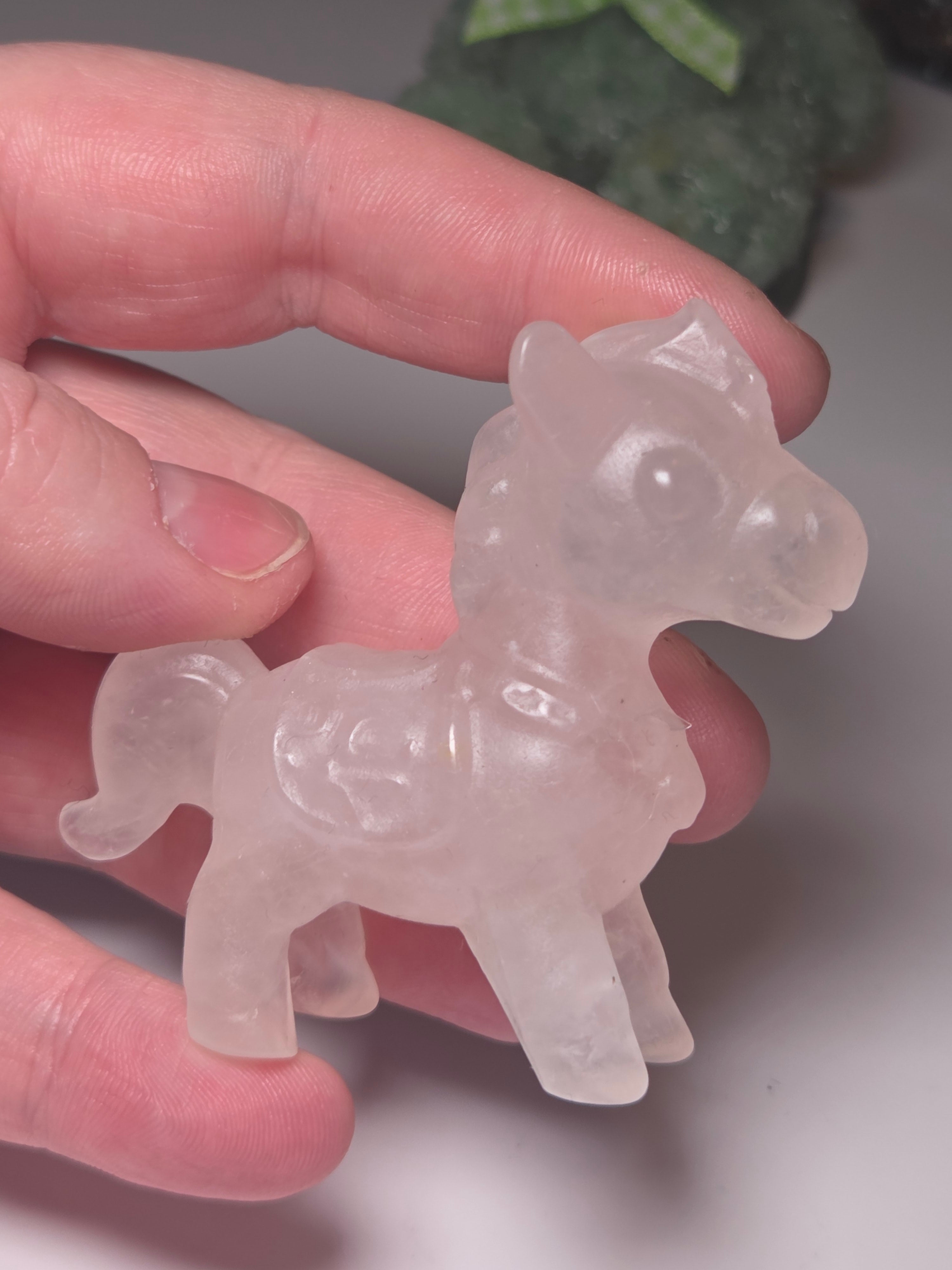 Rose quartz crystal horse carving