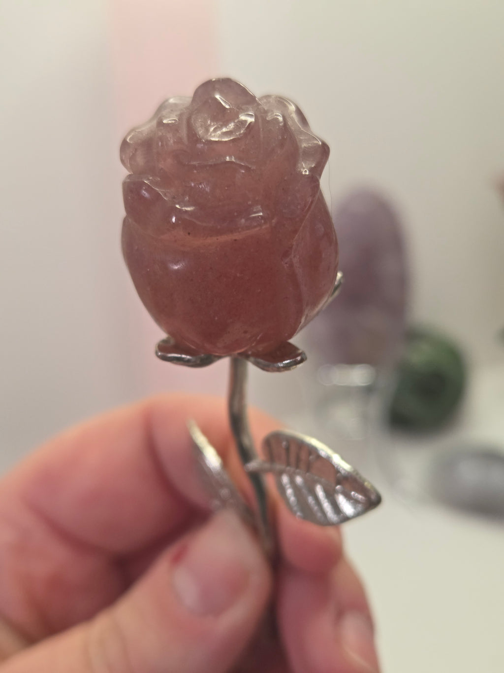 Strawberry quartz crystal rose carving on a stem