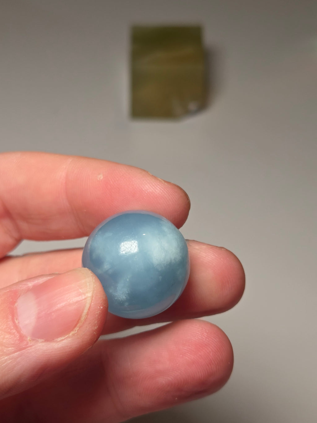 Aquamarine crystal sphere with stand