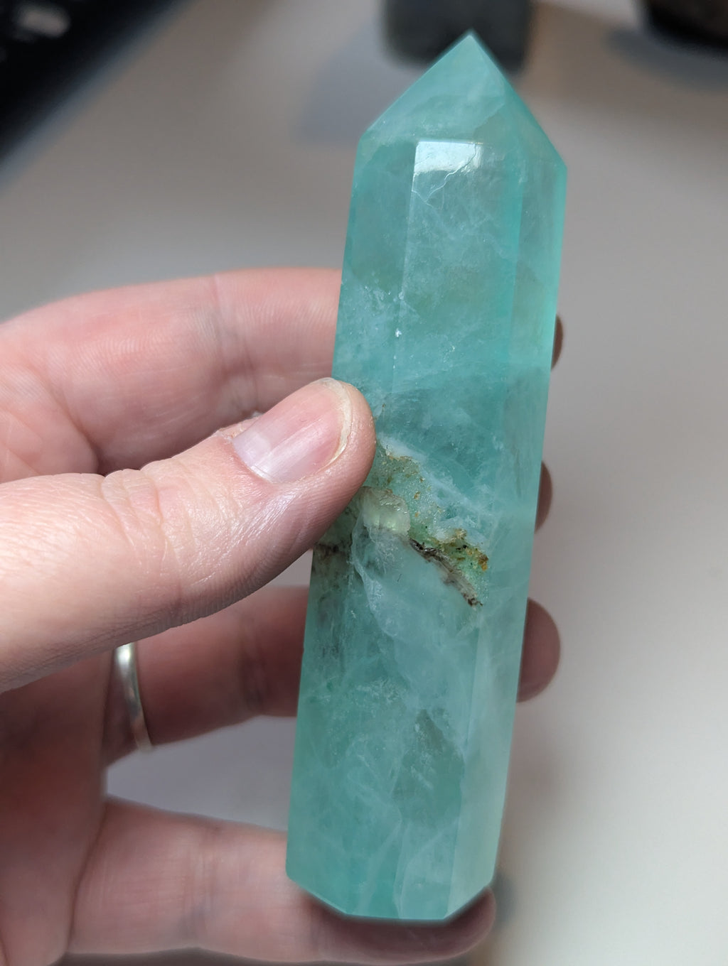 Green flouite crystal tower with imperfections