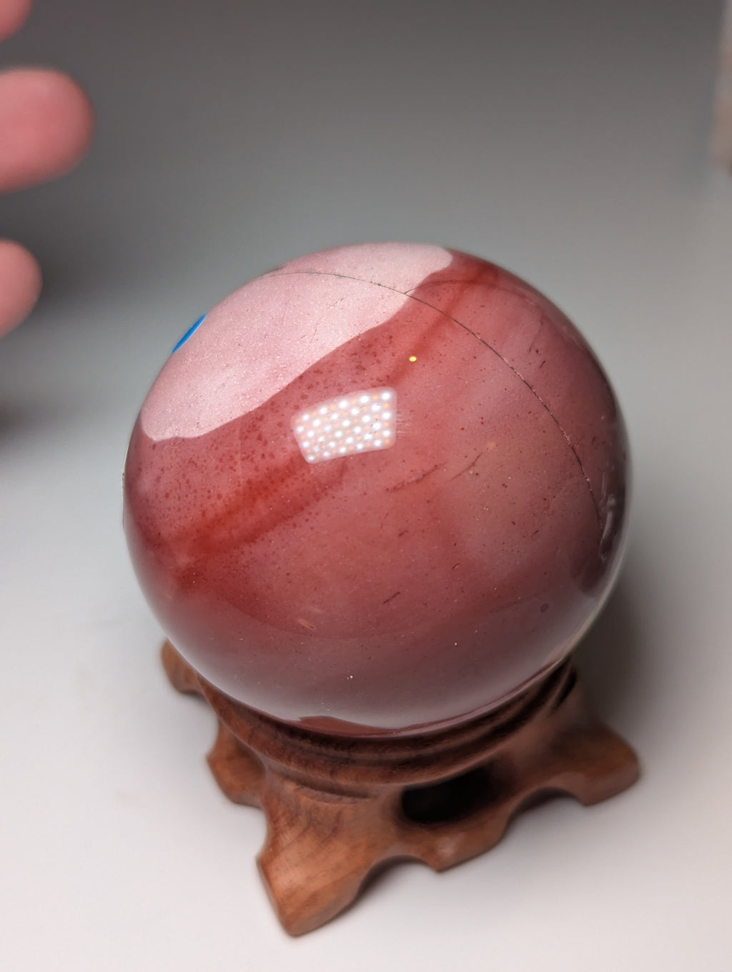 Mookite crystal sphere with stand