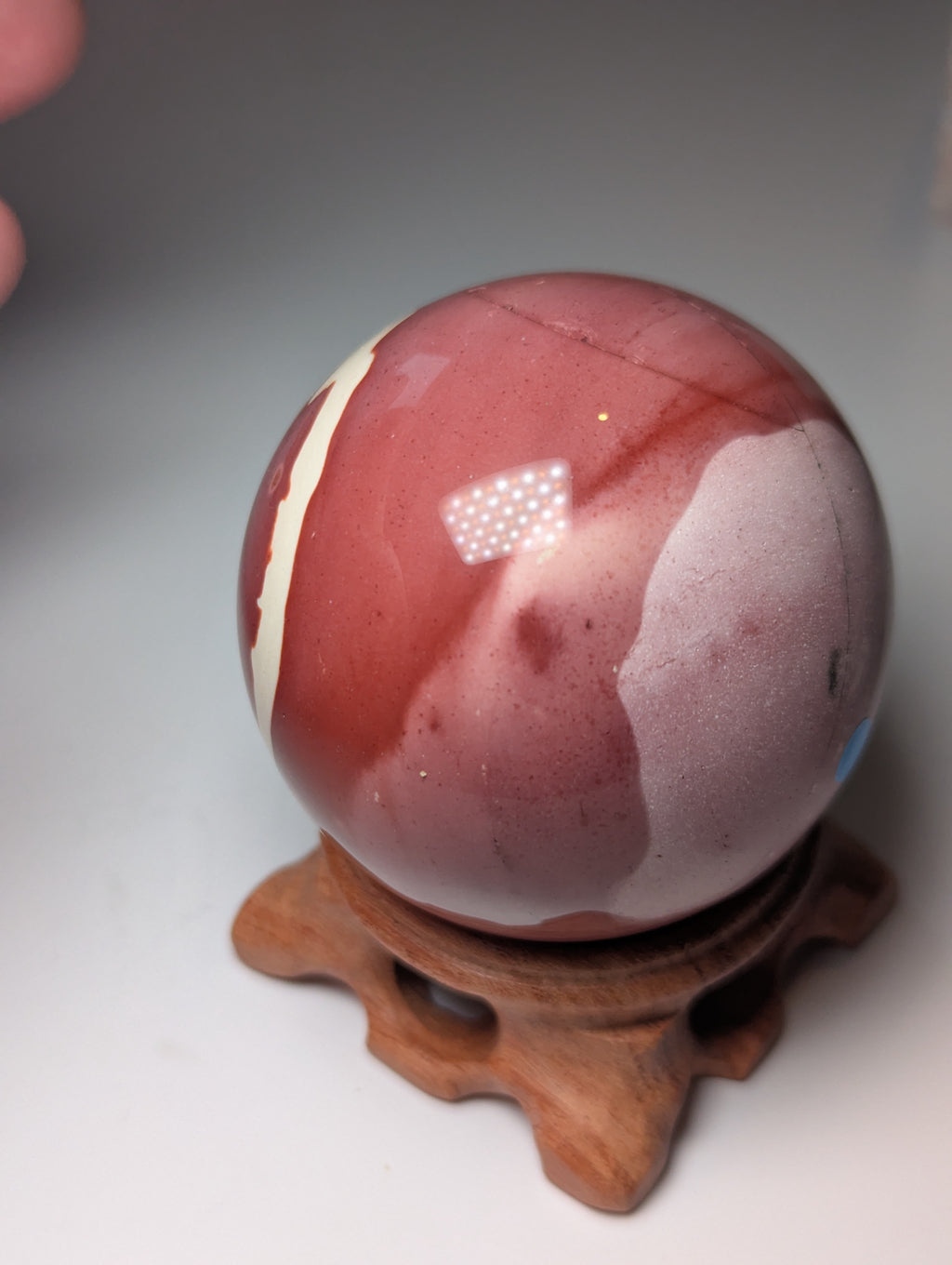 Mookite crystal sphere with stand