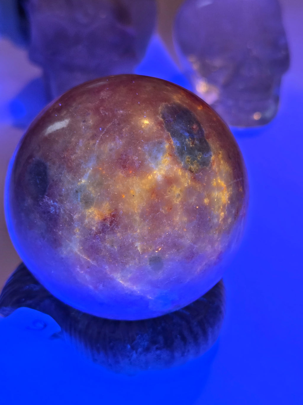 Pink zoisite crystal sphere carving with UV and comes with Stand