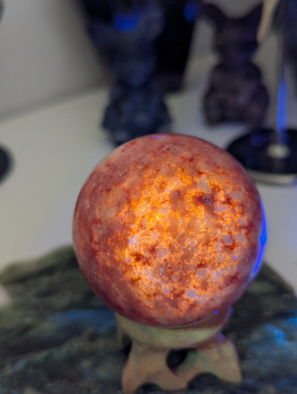 Pink Zoiltie crystal sphere with Orange UV