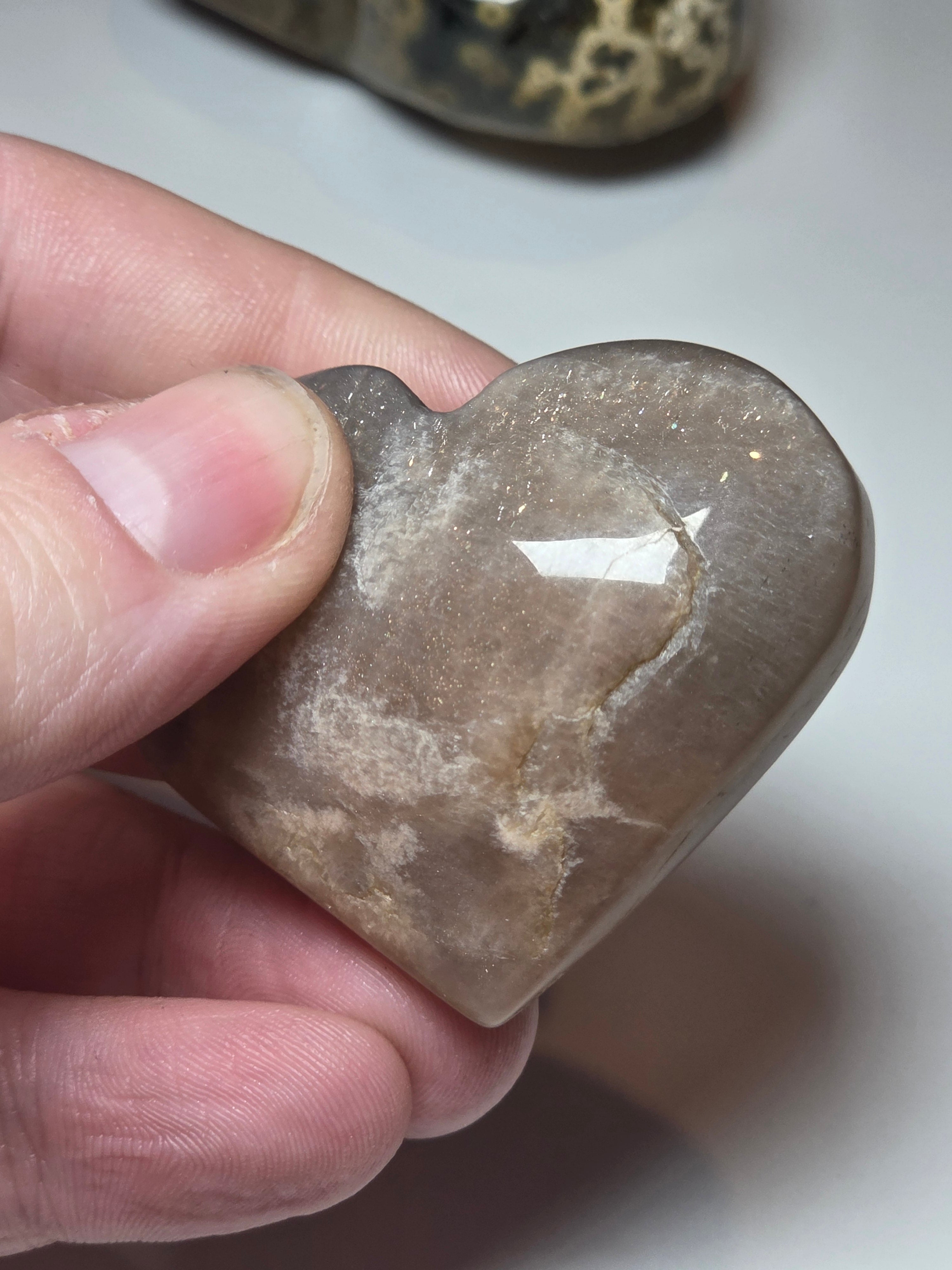 Sunstone and moonstone crystal heart carving with imperfections
