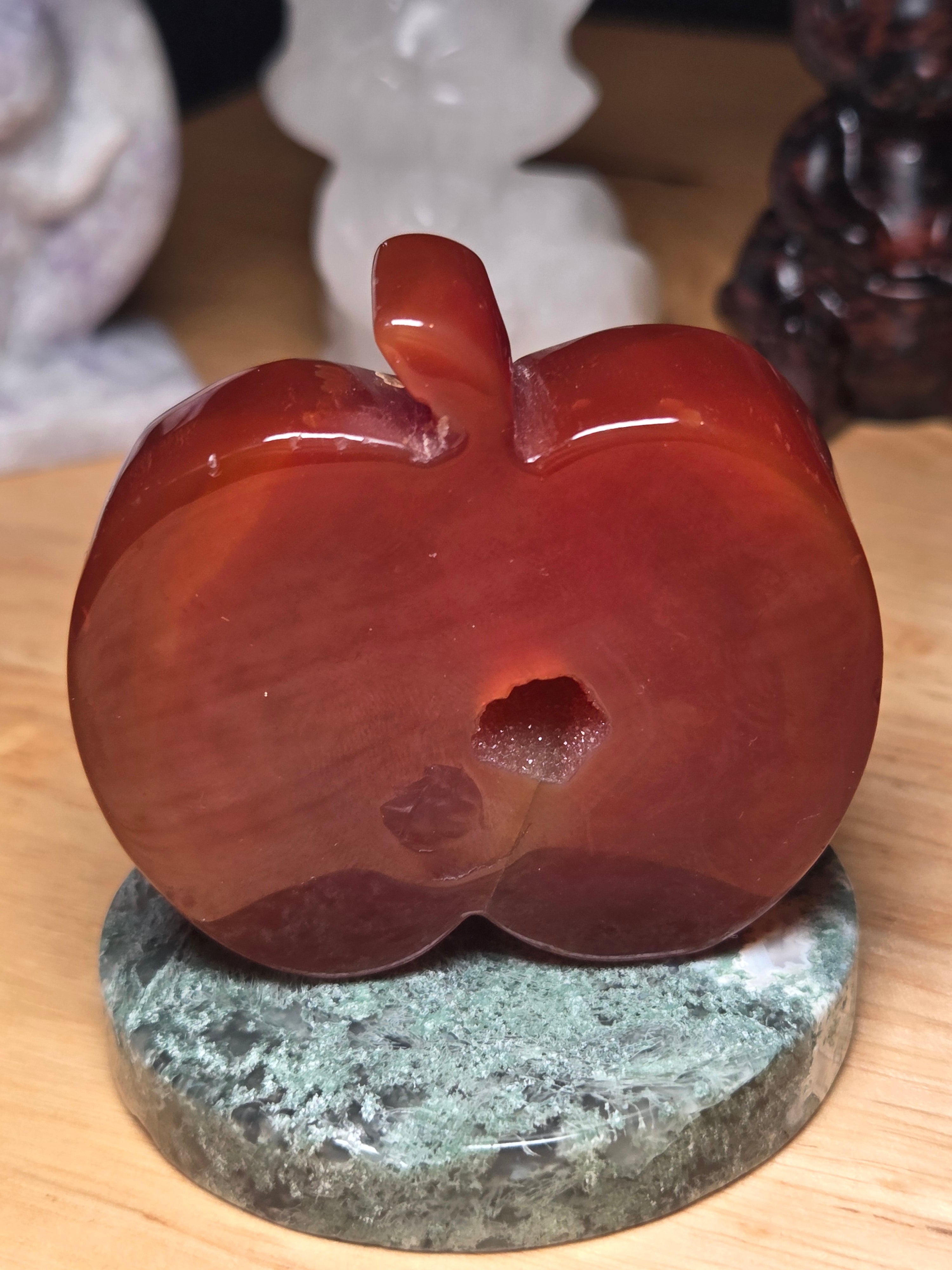 Carnelian crystal apple with imperfections