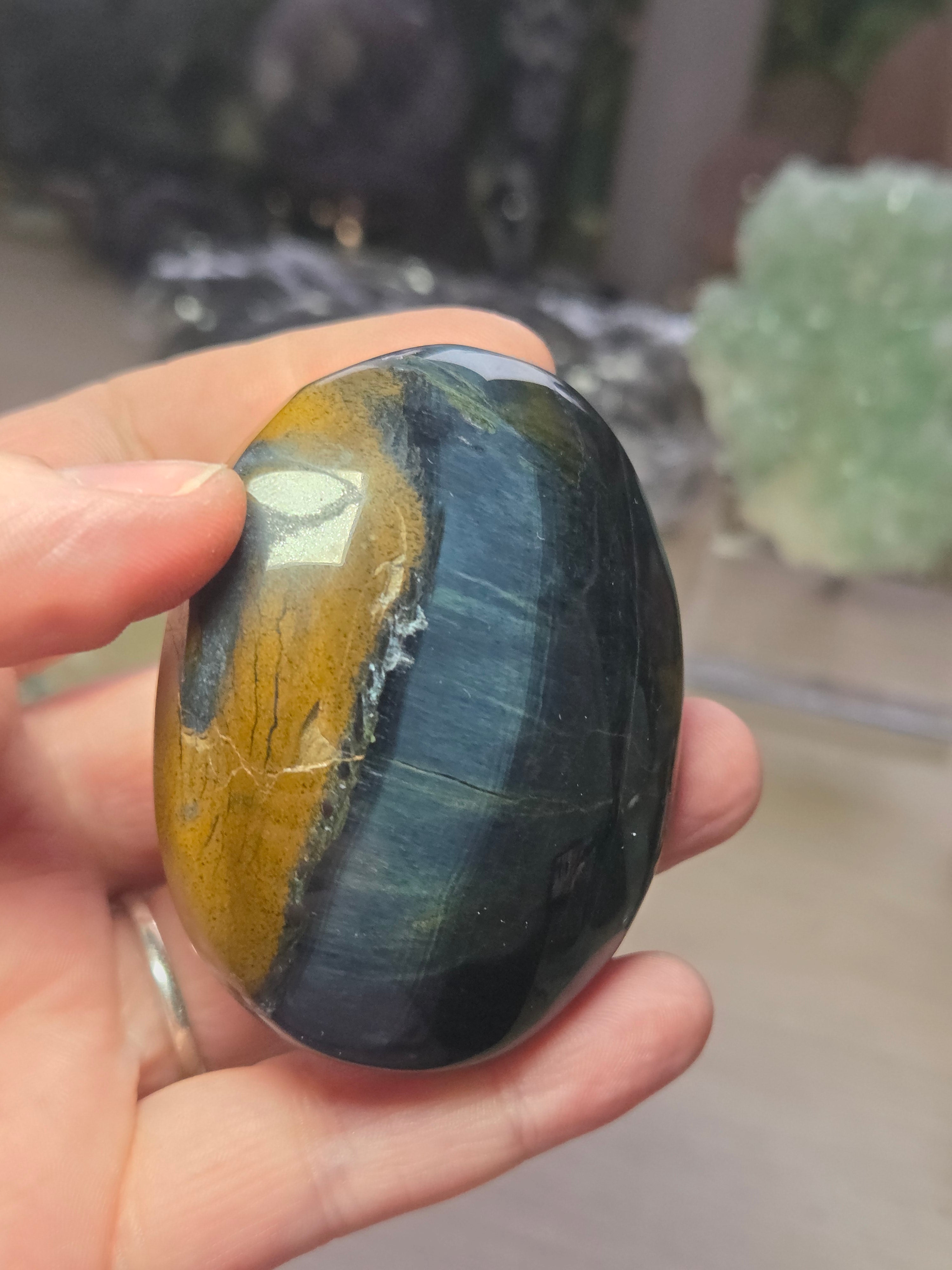 Tigers eye palm stone with Imperfections