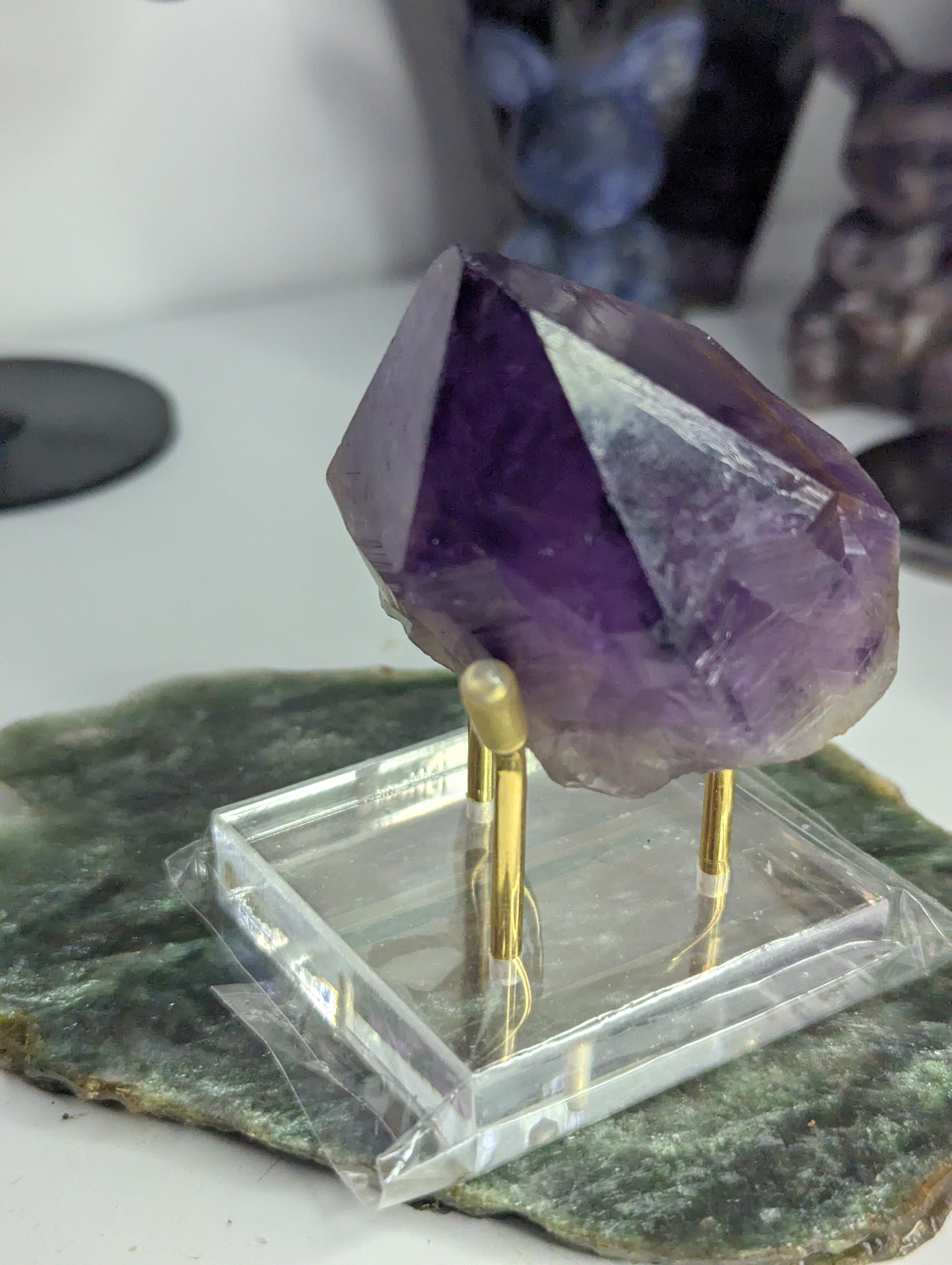 Amethyst crystal tooth from Brazil with stand