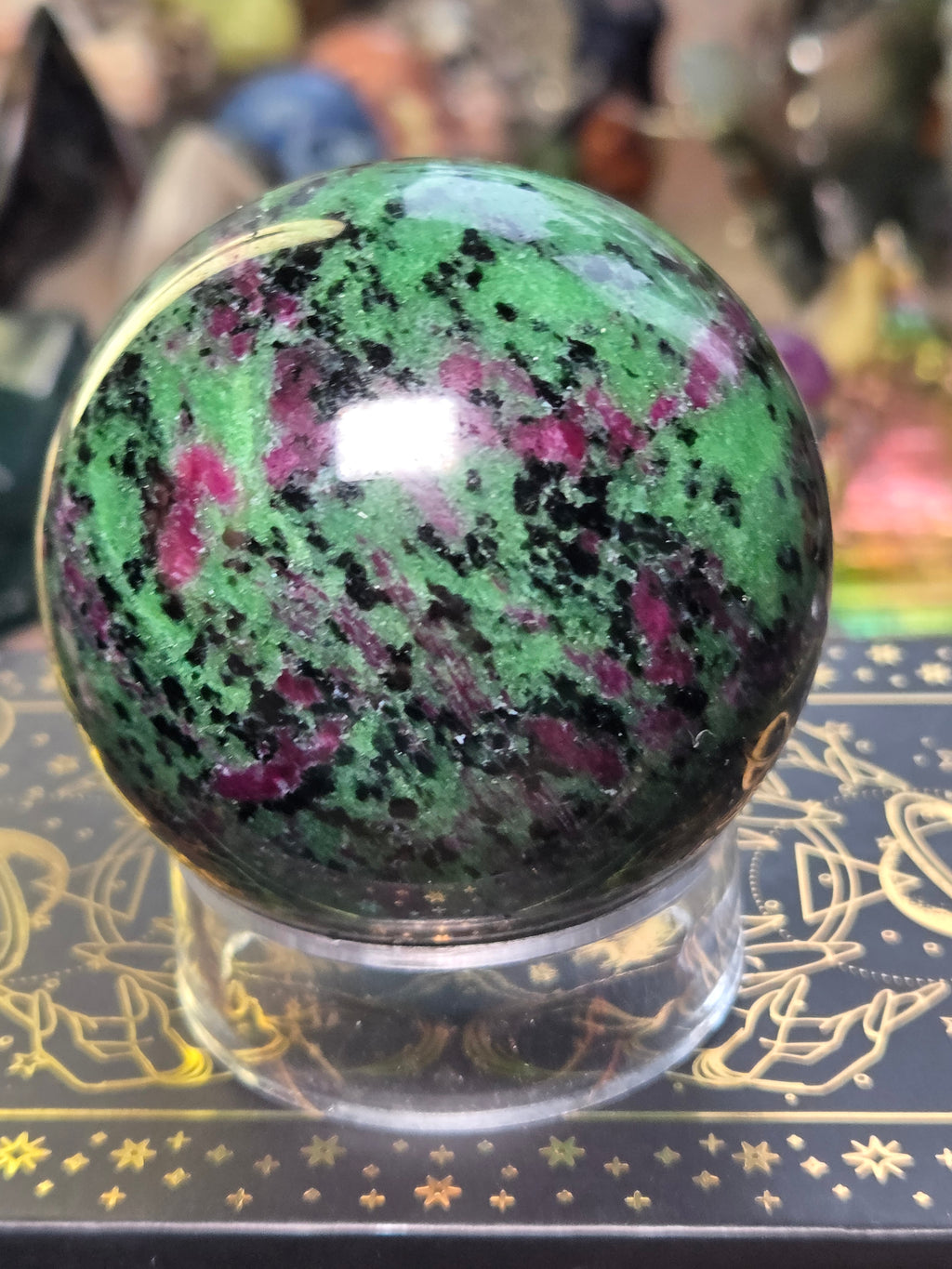 Ruby in zoisite crystal sphere carving