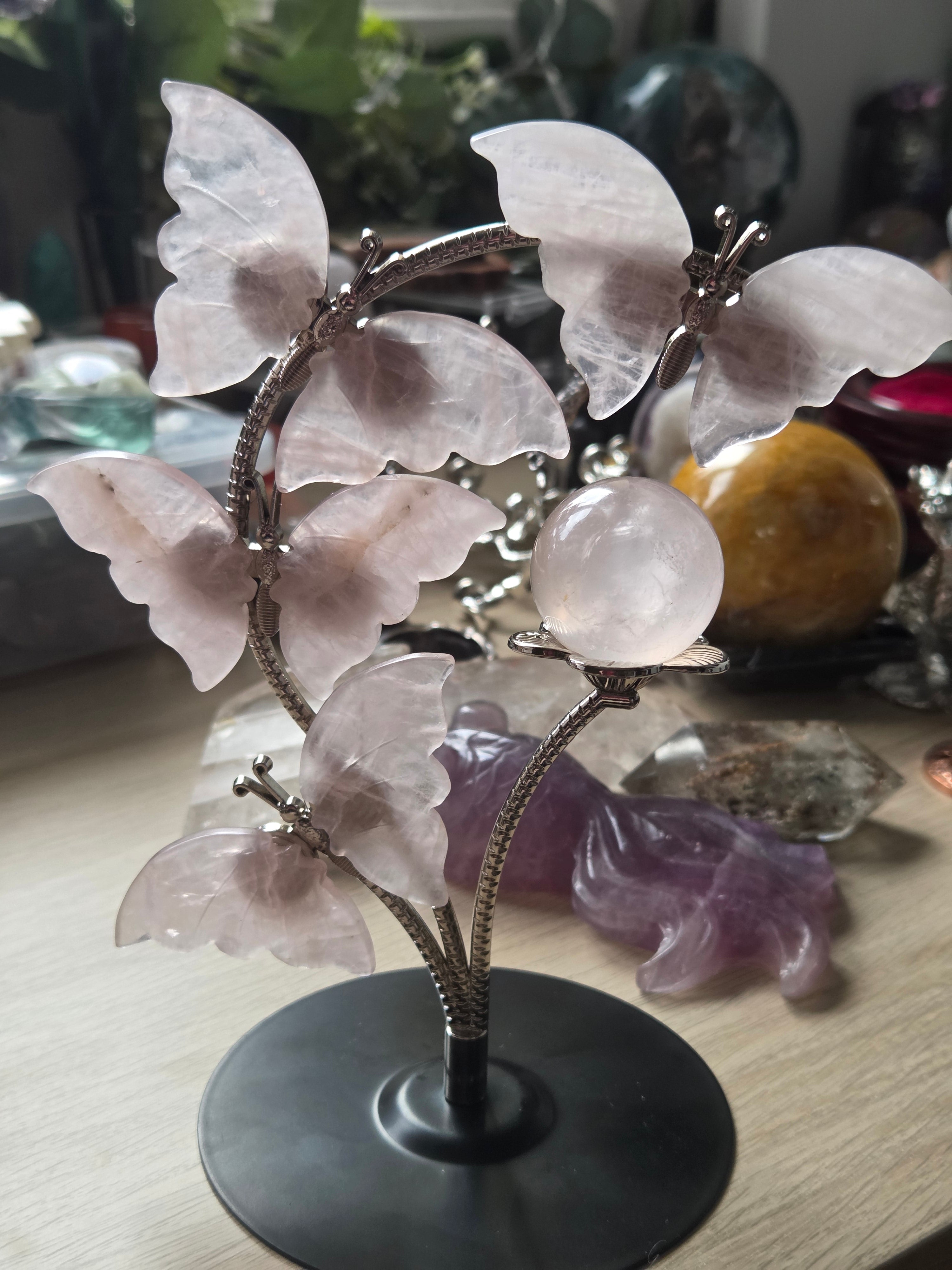 Rose quartz crystal sphere and  butterfly stand