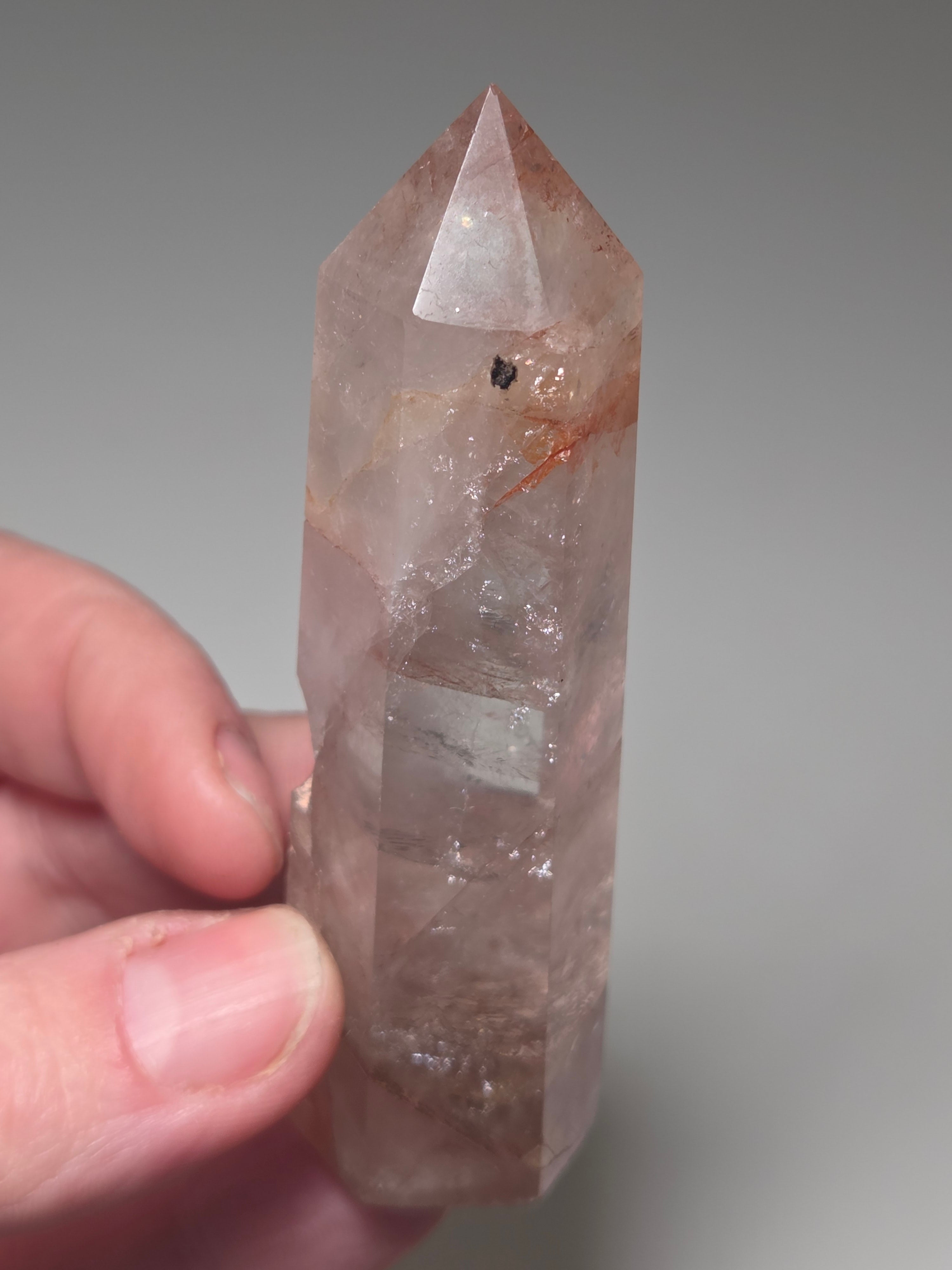 Fire quartz crystal tower with imperfections