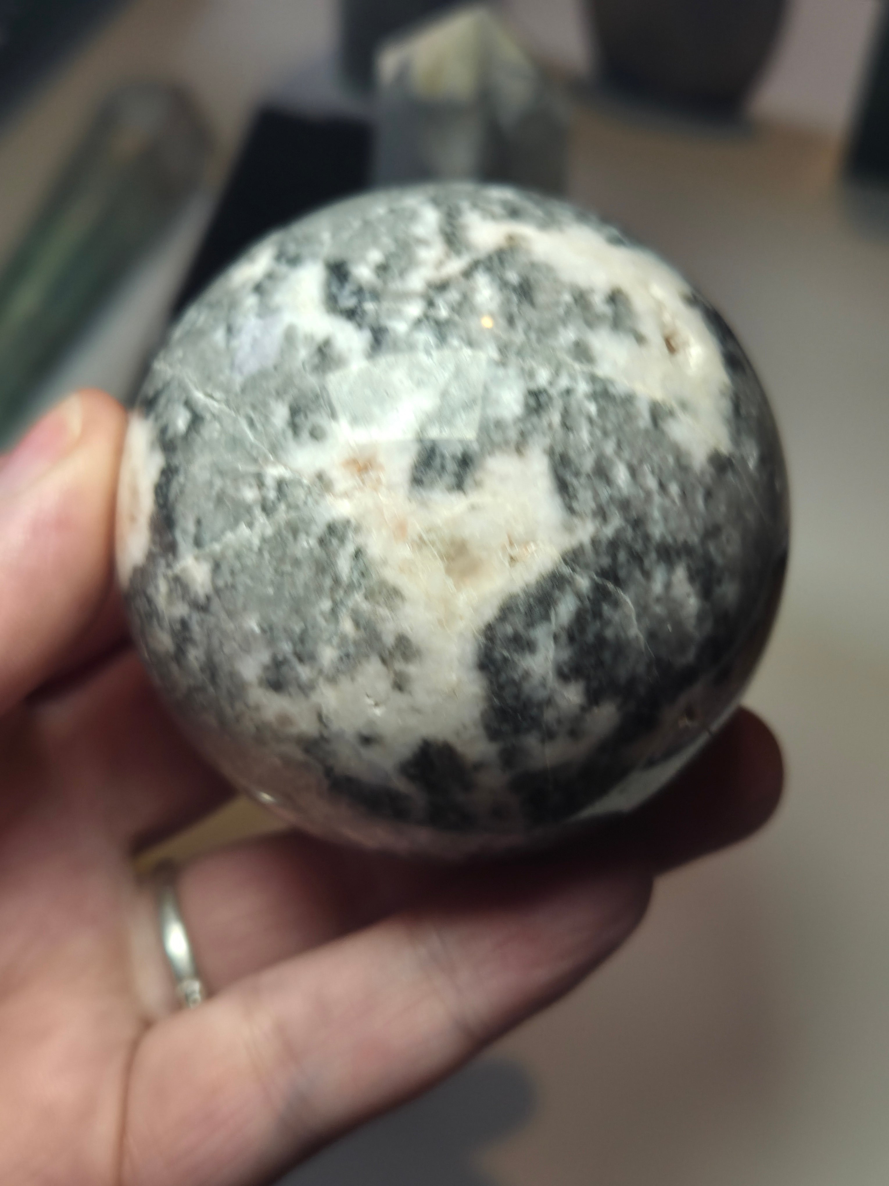 Pink rhodonite crystal sphere