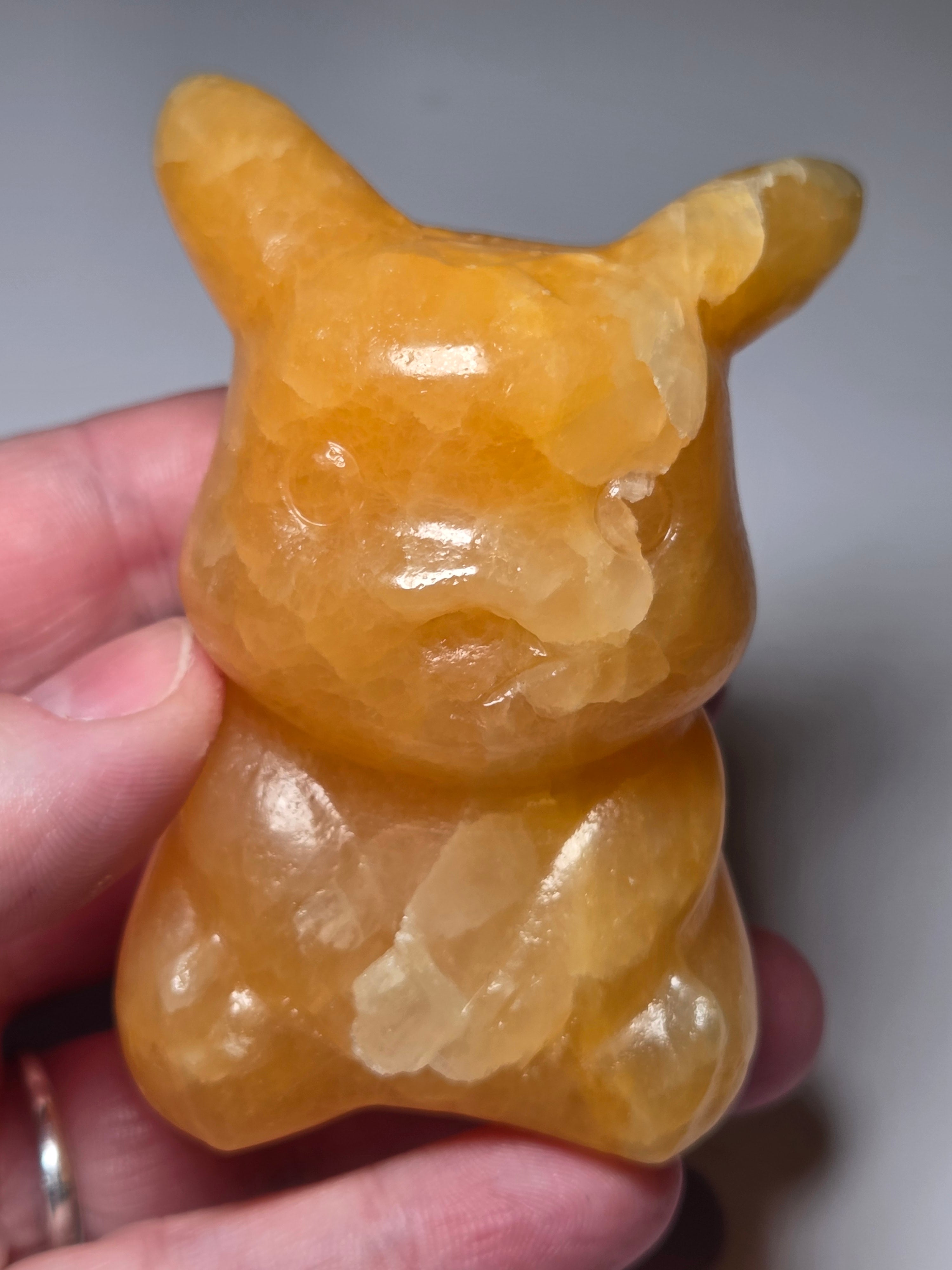 Orange calcite crystal pikachu pokemon carving
