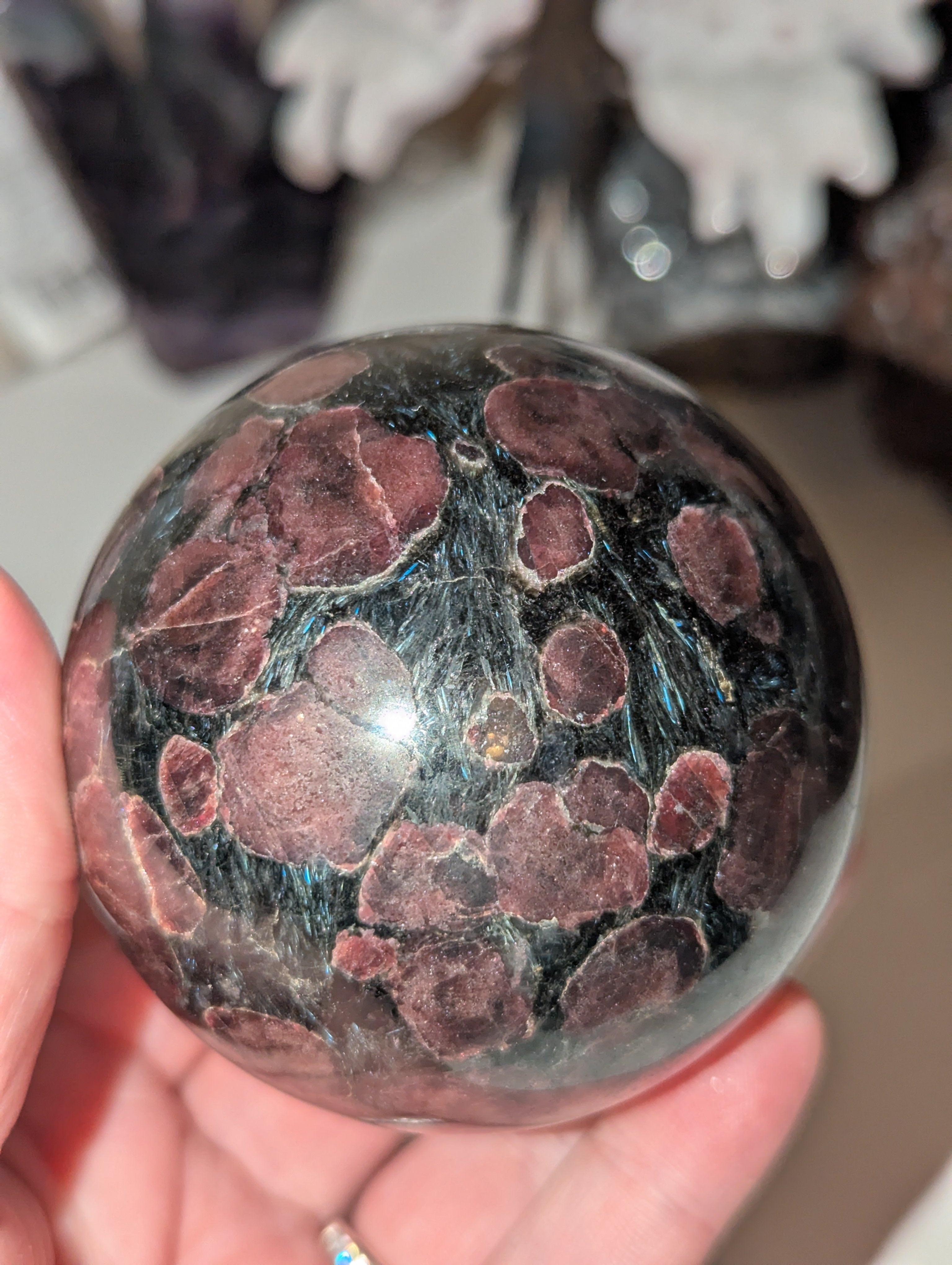 Astrophylite crystal sphere with garnet