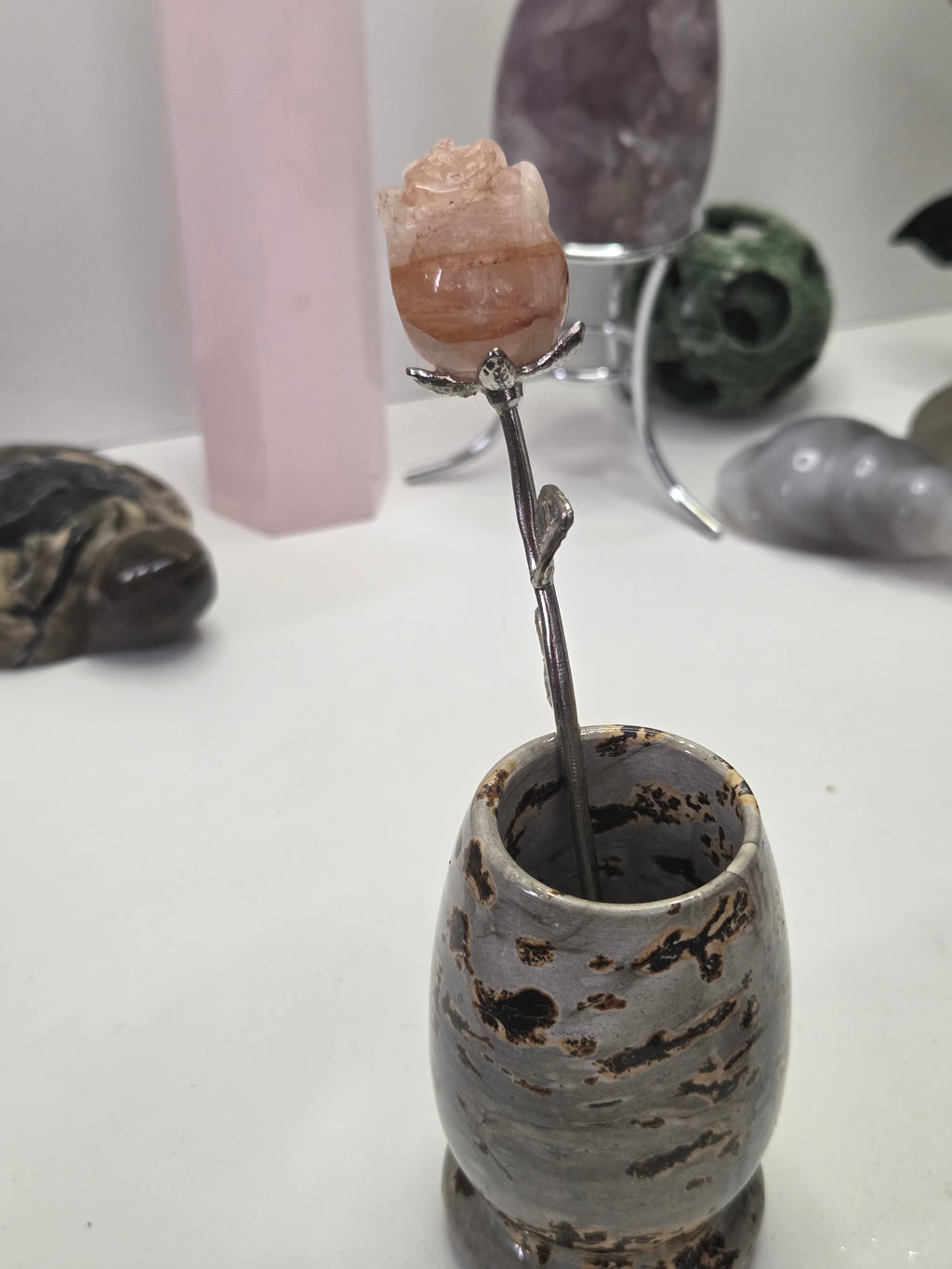 Fire quartz crystal rose carving on a stem