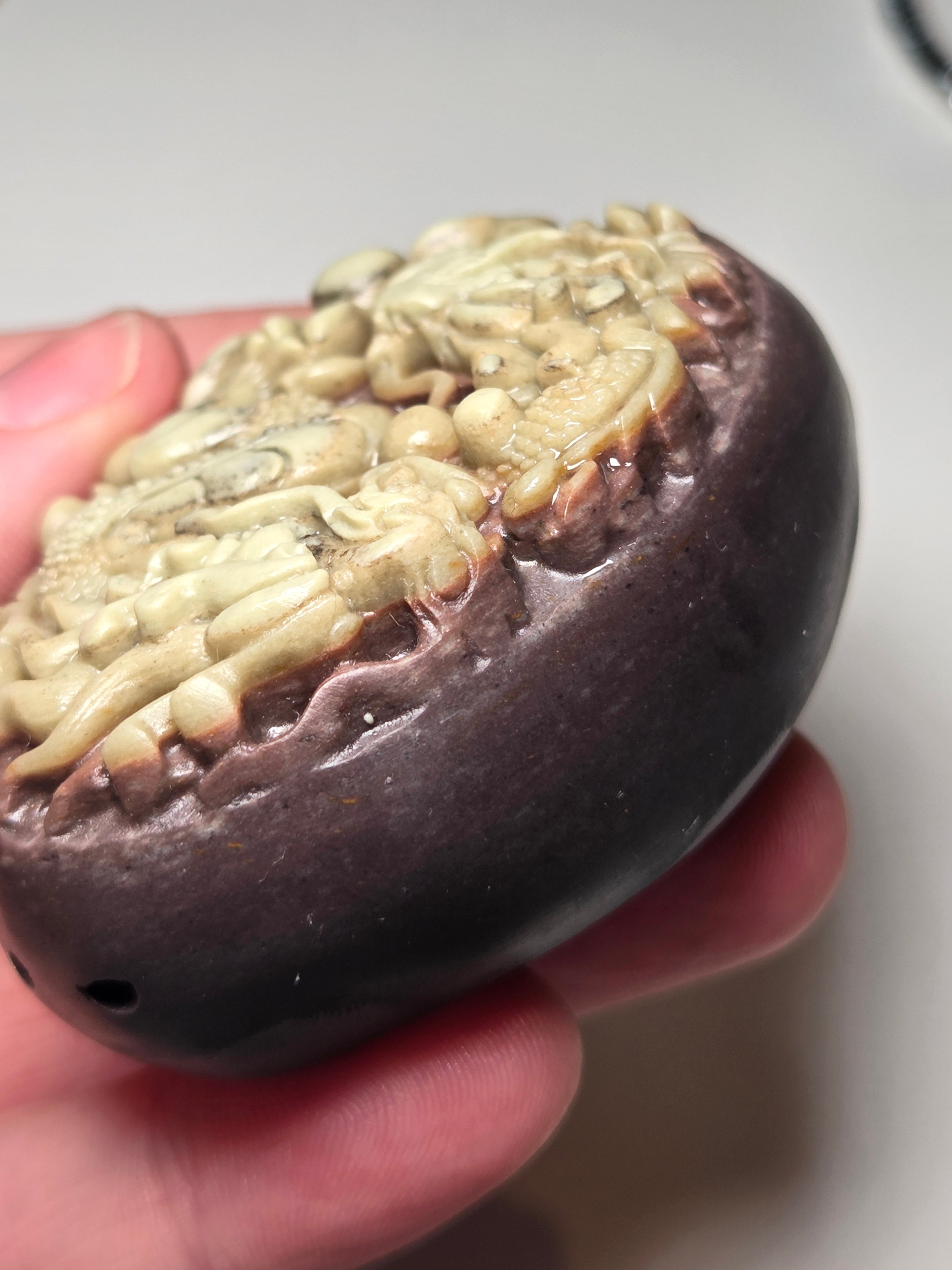 Handmade carved dragon palm stone in purple jade from Province