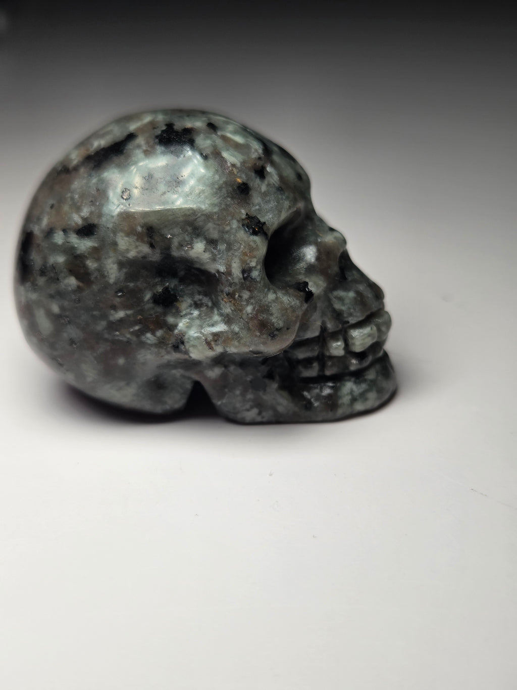 Small Yooperlite crystal skull carving