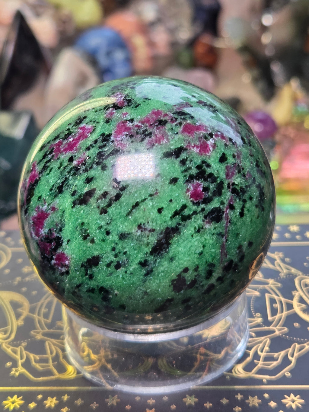 Ruby in zoisite crystal sphere carving
