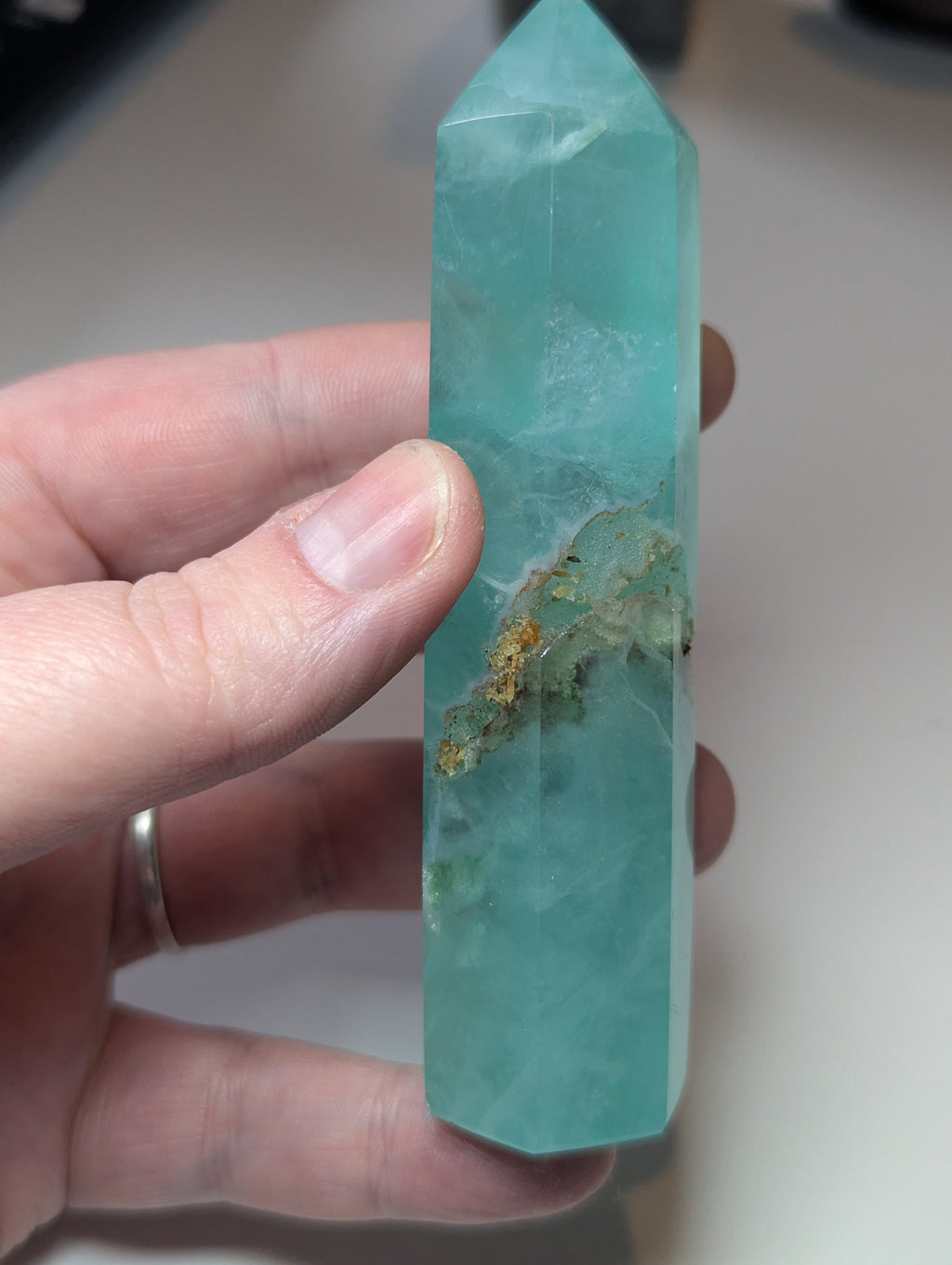 Green flouite crystal tower with imperfections