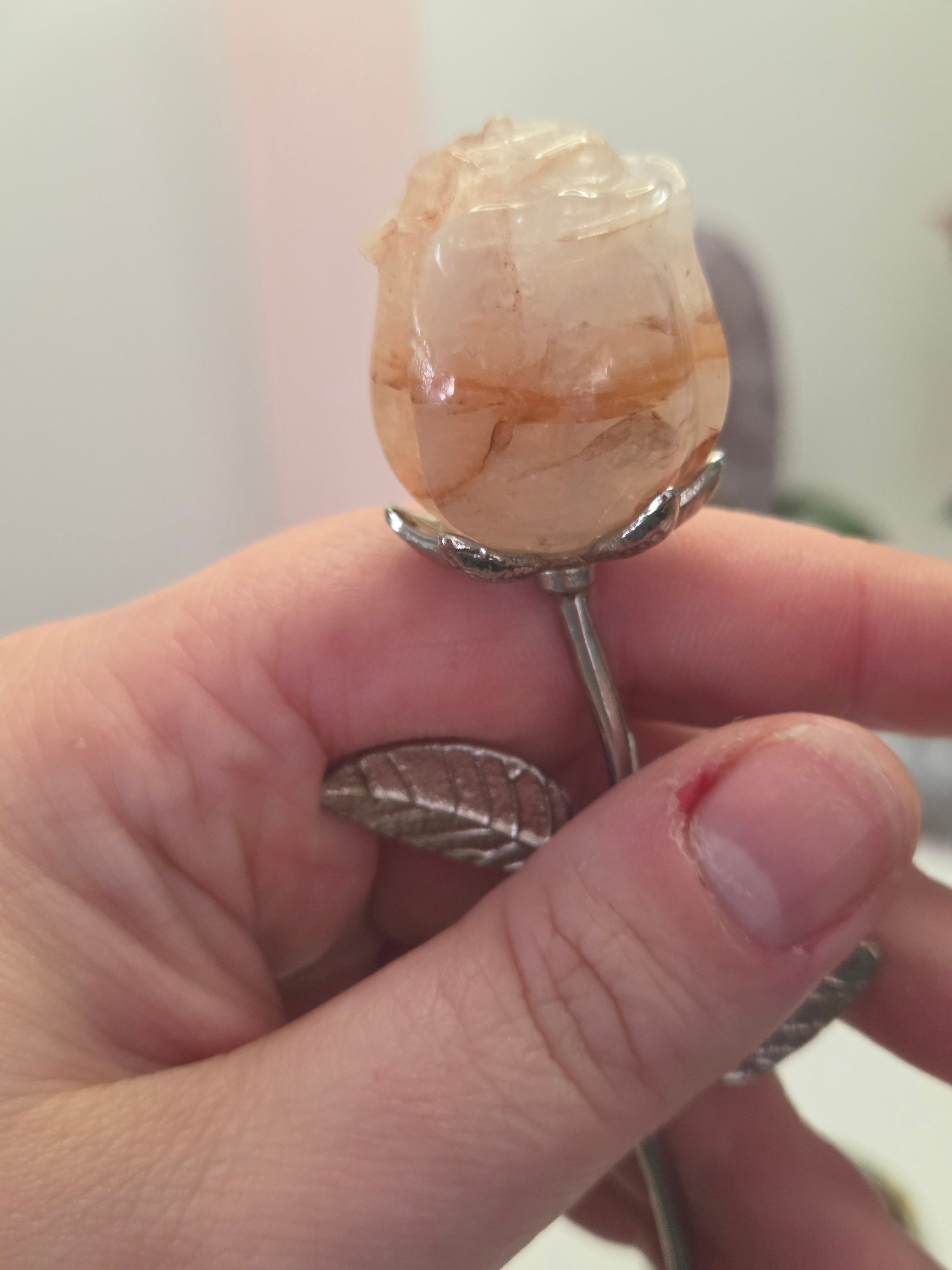 Fire quartz crystal rose carving on a stem
