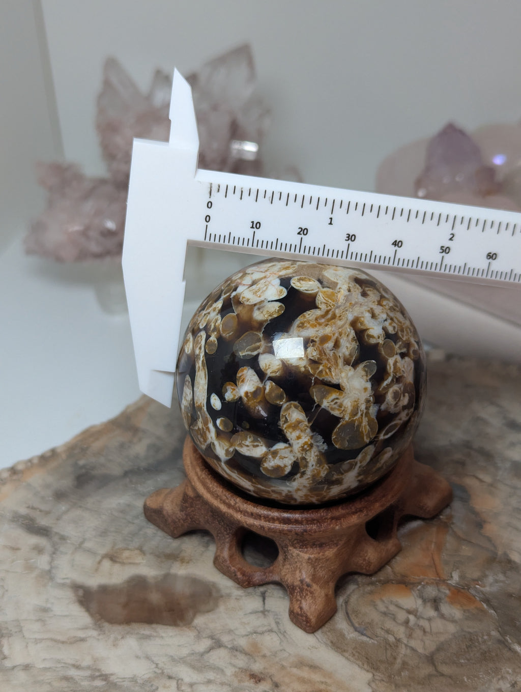 Natural Amber with calcite crystal sphere