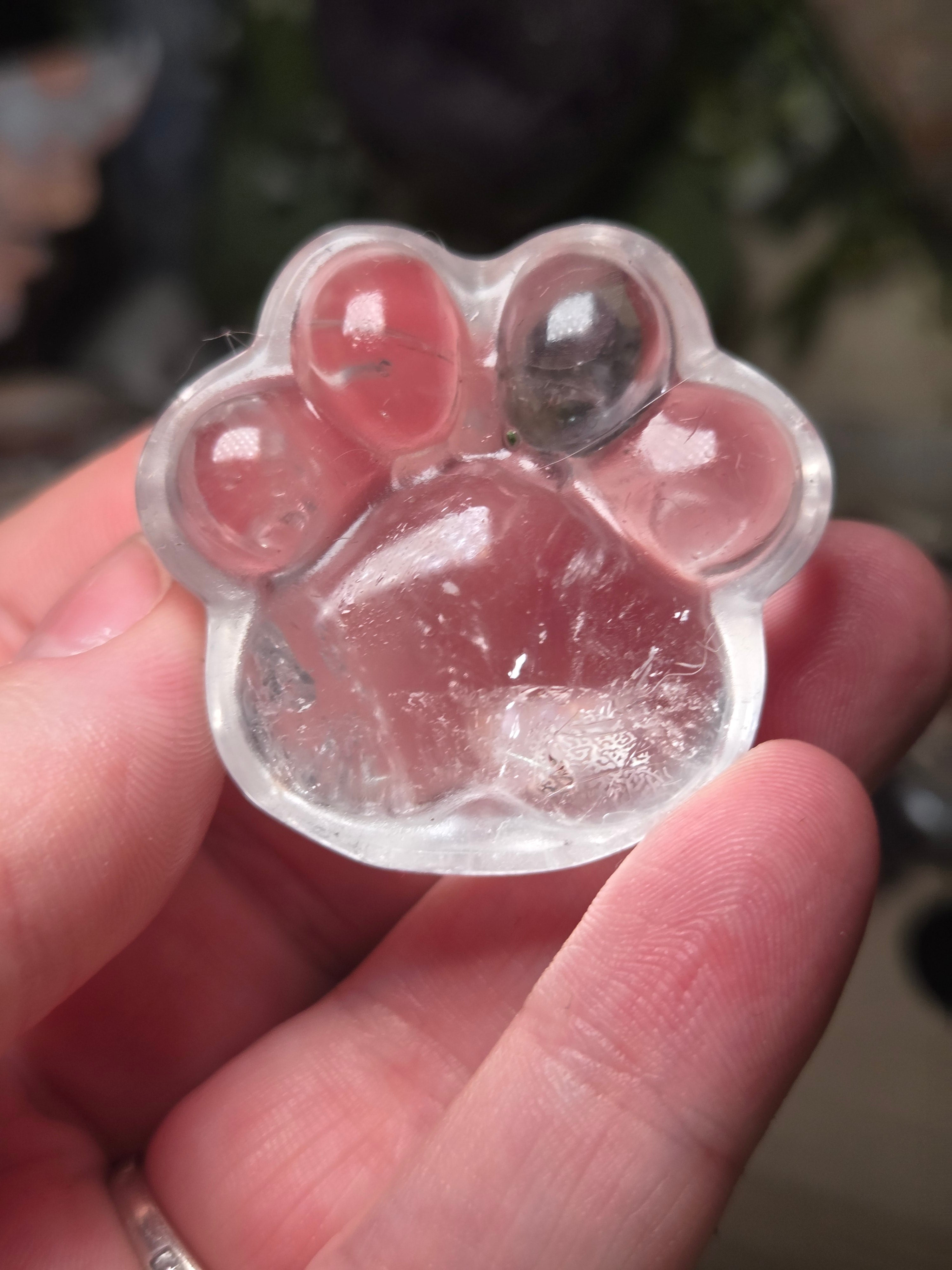 Clear quartz crystal paw print carving