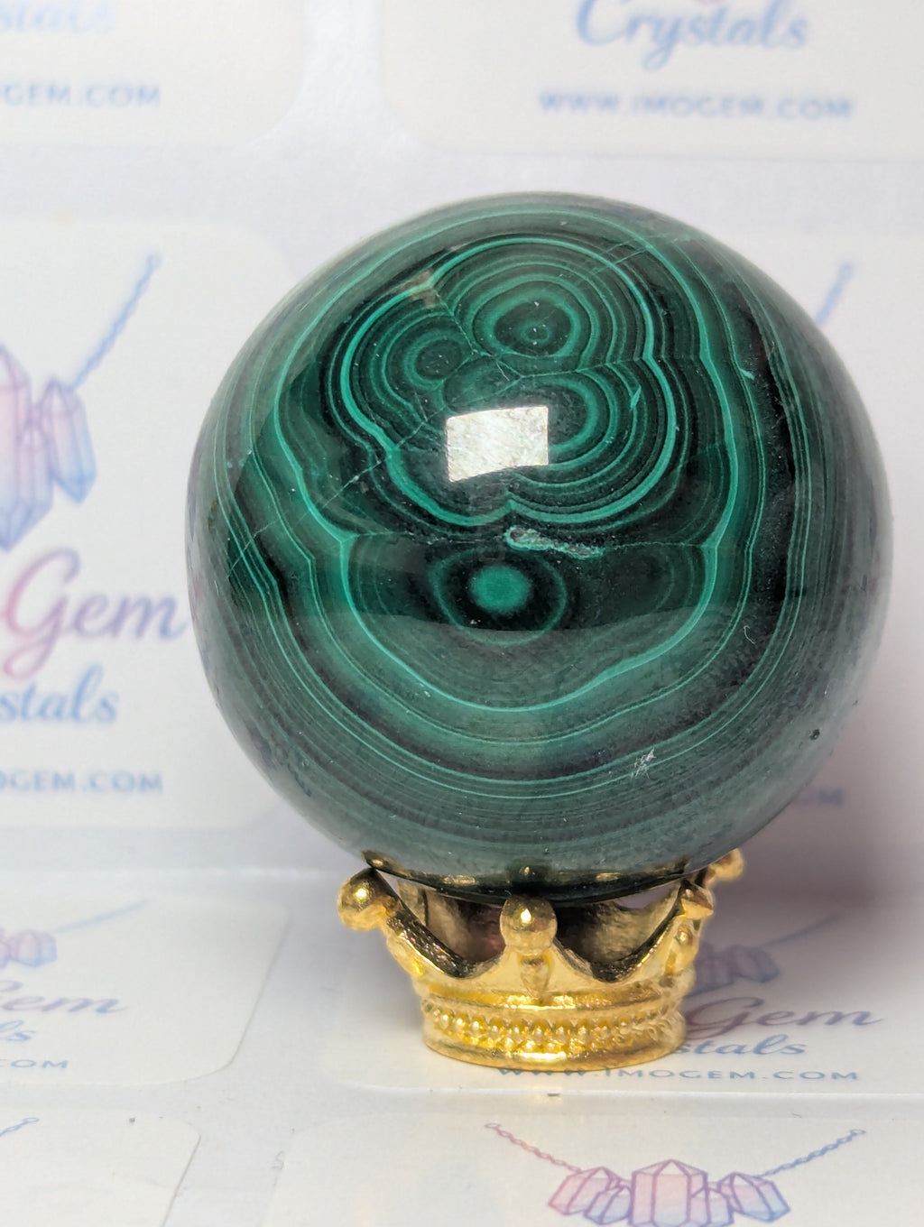 Malicite crystal sphere with imperfections