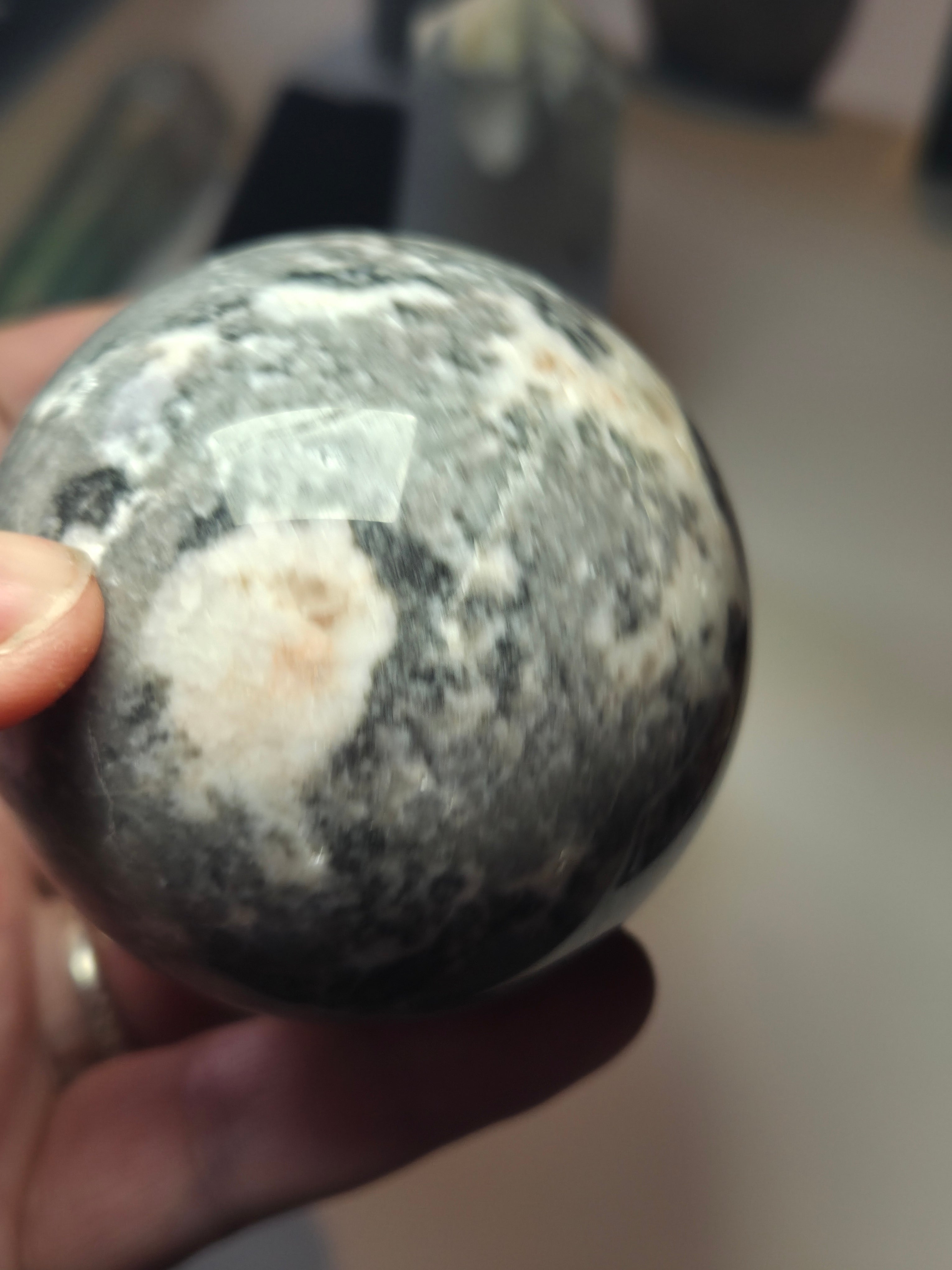 Pink rhodonite crystal sphere