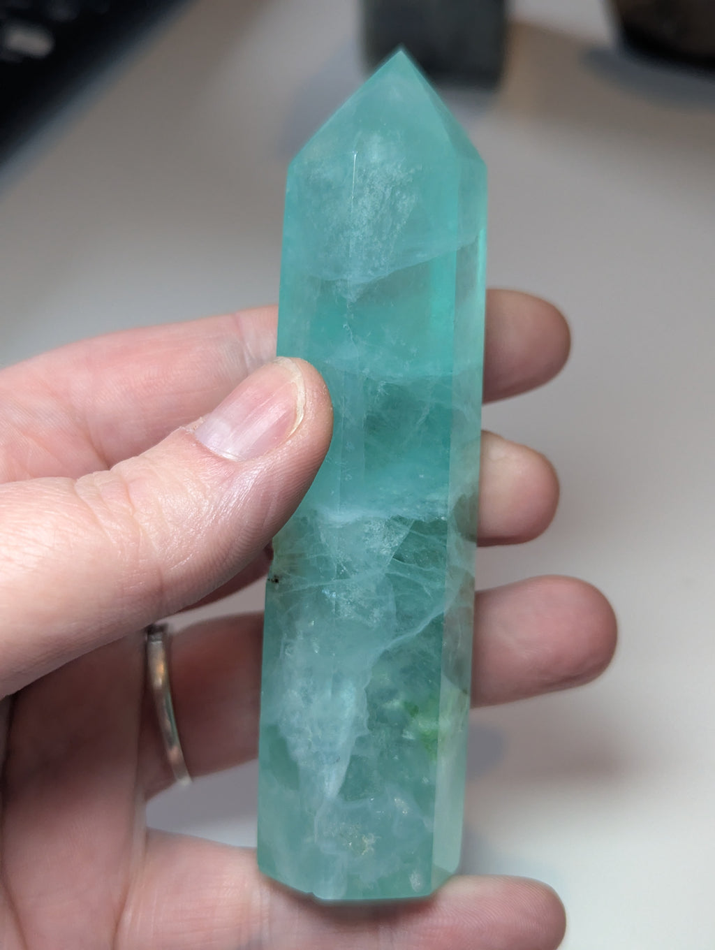 Green flouite crystal tower with imperfections